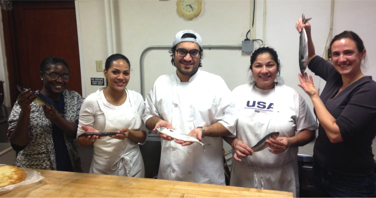 Our board president Sarah Schumann (right) with Chef Joshua Riazi (middle) of the genesis Center, with three of his students. they spent an afternoon exploring the application of African, Central American, and Caribbean recipes to local herring, mackerel, and scup. More about this experiment can be found in sarah's write-up in 41N, Rhode Island's coastal and ocean magazine.