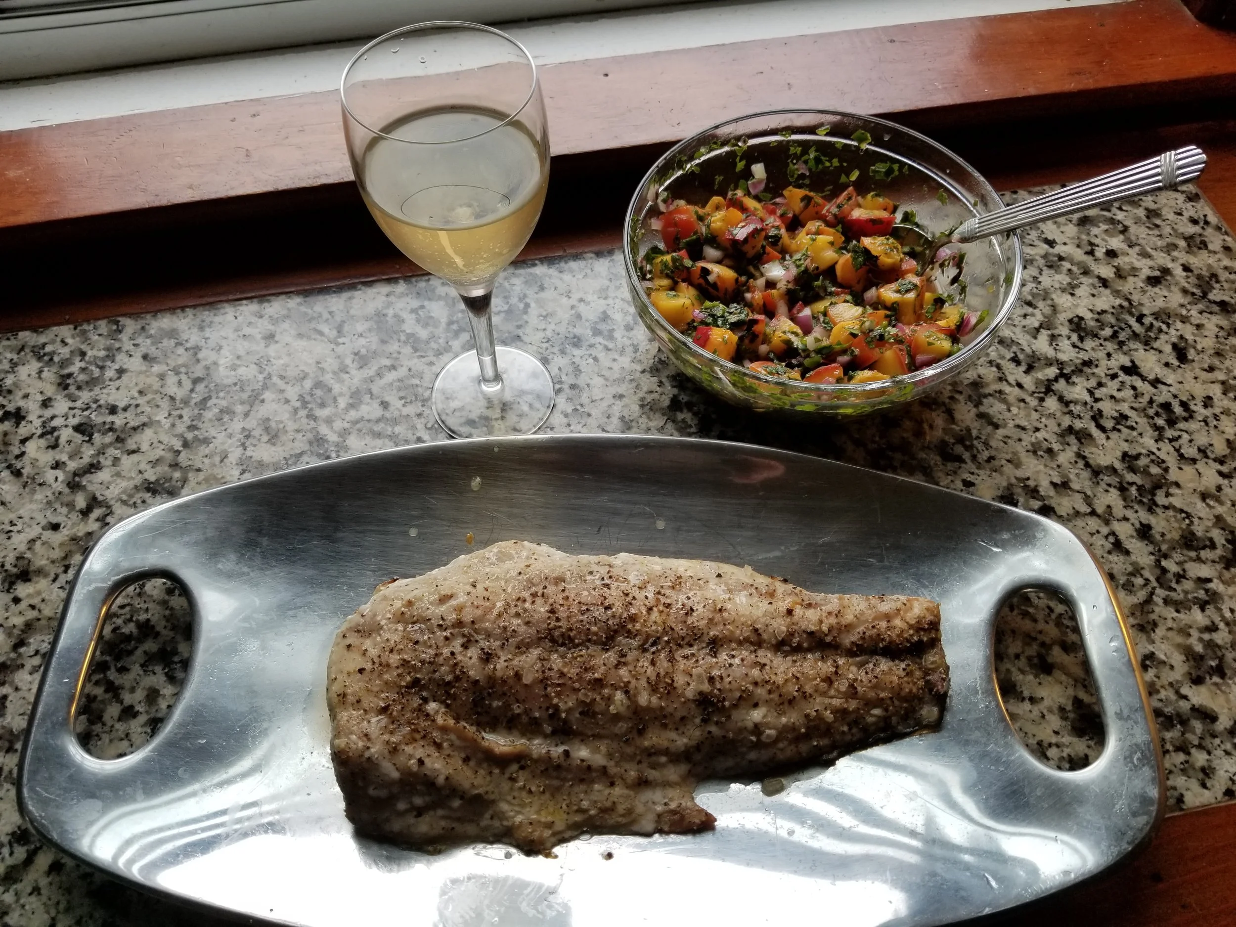 Roasted sea bass with grilled peach salsa