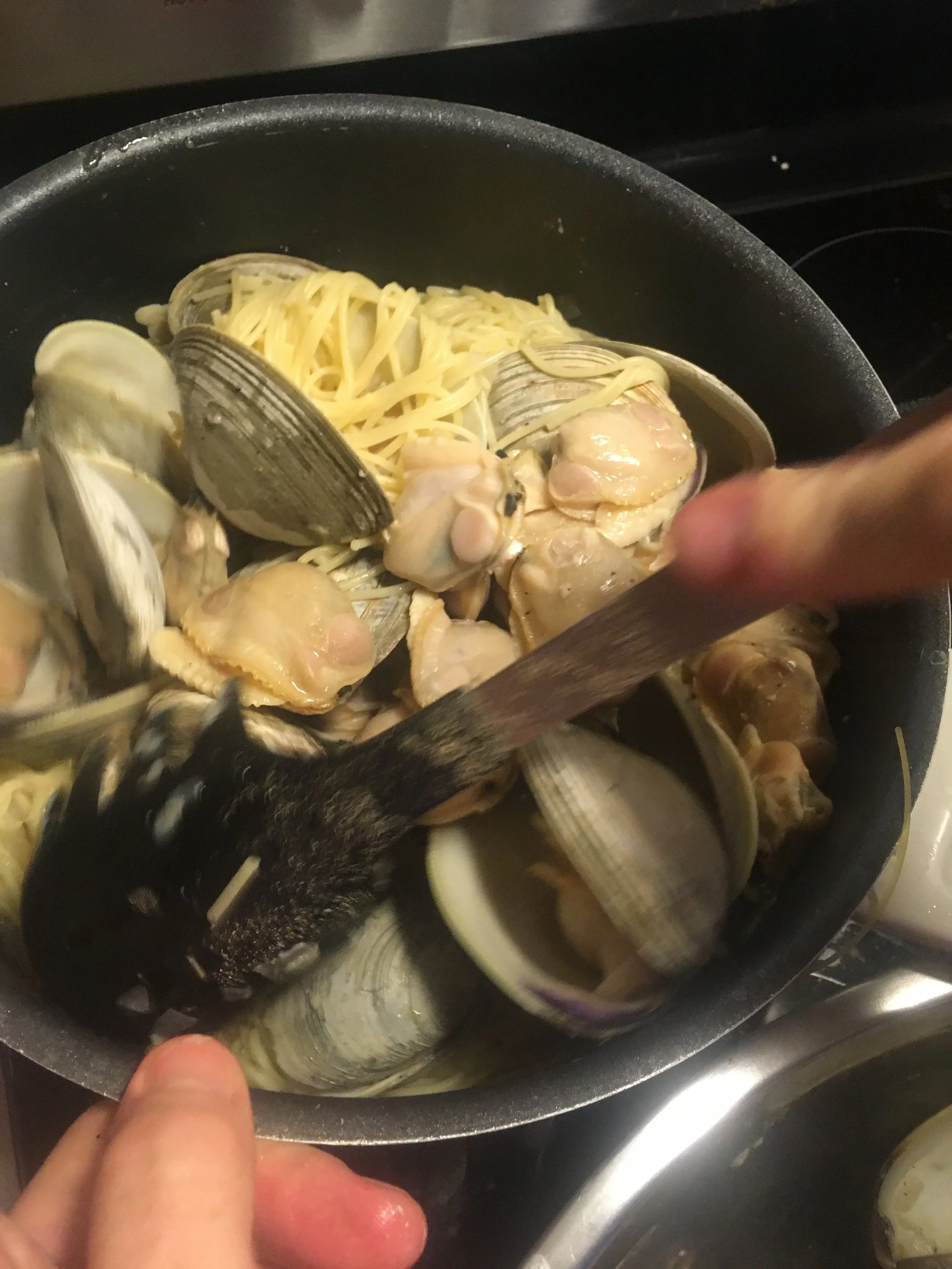 Clams and linguine with sausage