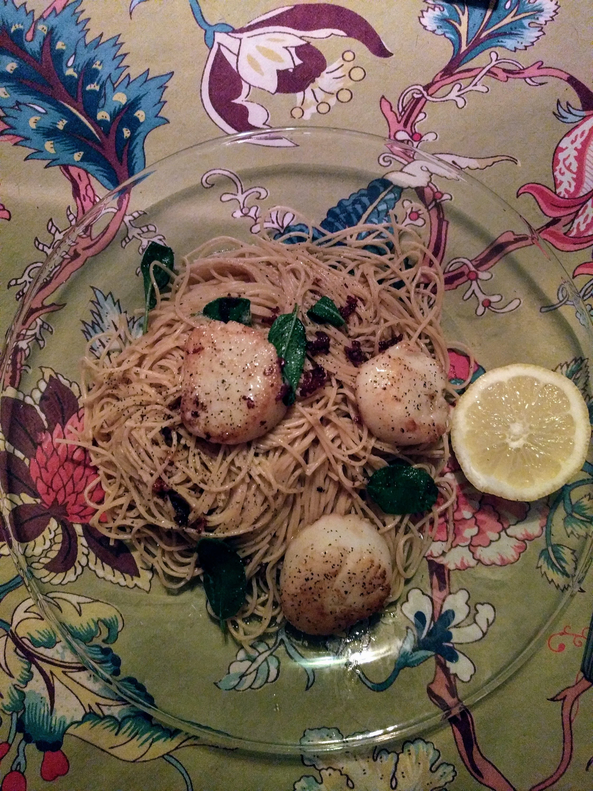 Seared sea scallops with fried sage and a brown butter sauce over angel hair pasta