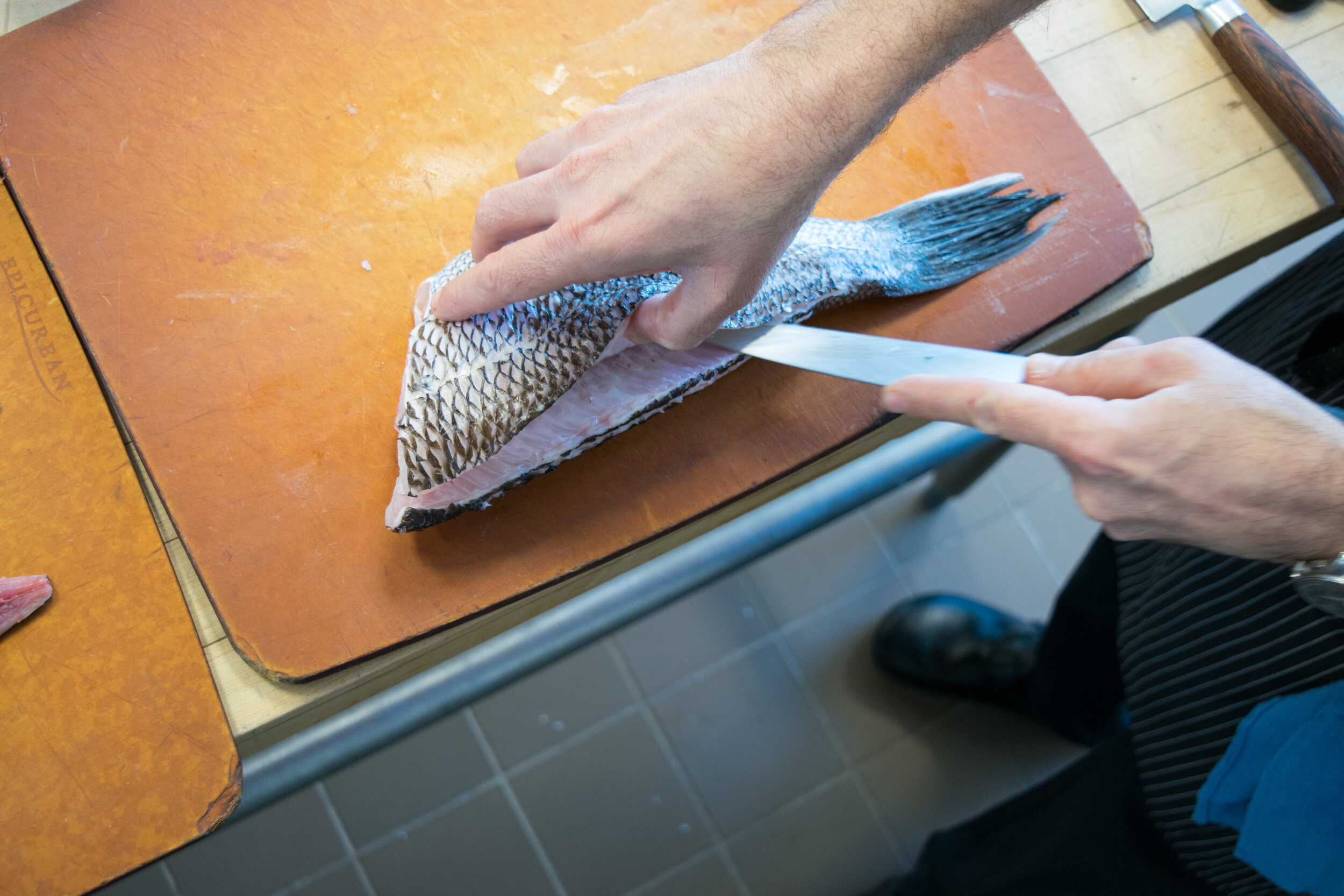 Step 6. Following the cut you just made, continue slicing the meat away from the bones.