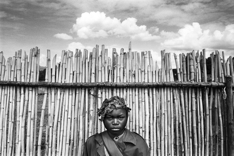 Boy soldier waits at Kpandroma's transit center