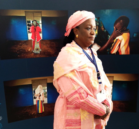  Ms Zainab Banger, Special Representive to the UN for Sexual Violence in Conflict, standing in front of PROOF's Legacy of Rape exhibit while it was on display as part of The Missing Peace Symposium at the United States Institute of Peace, March 2013.