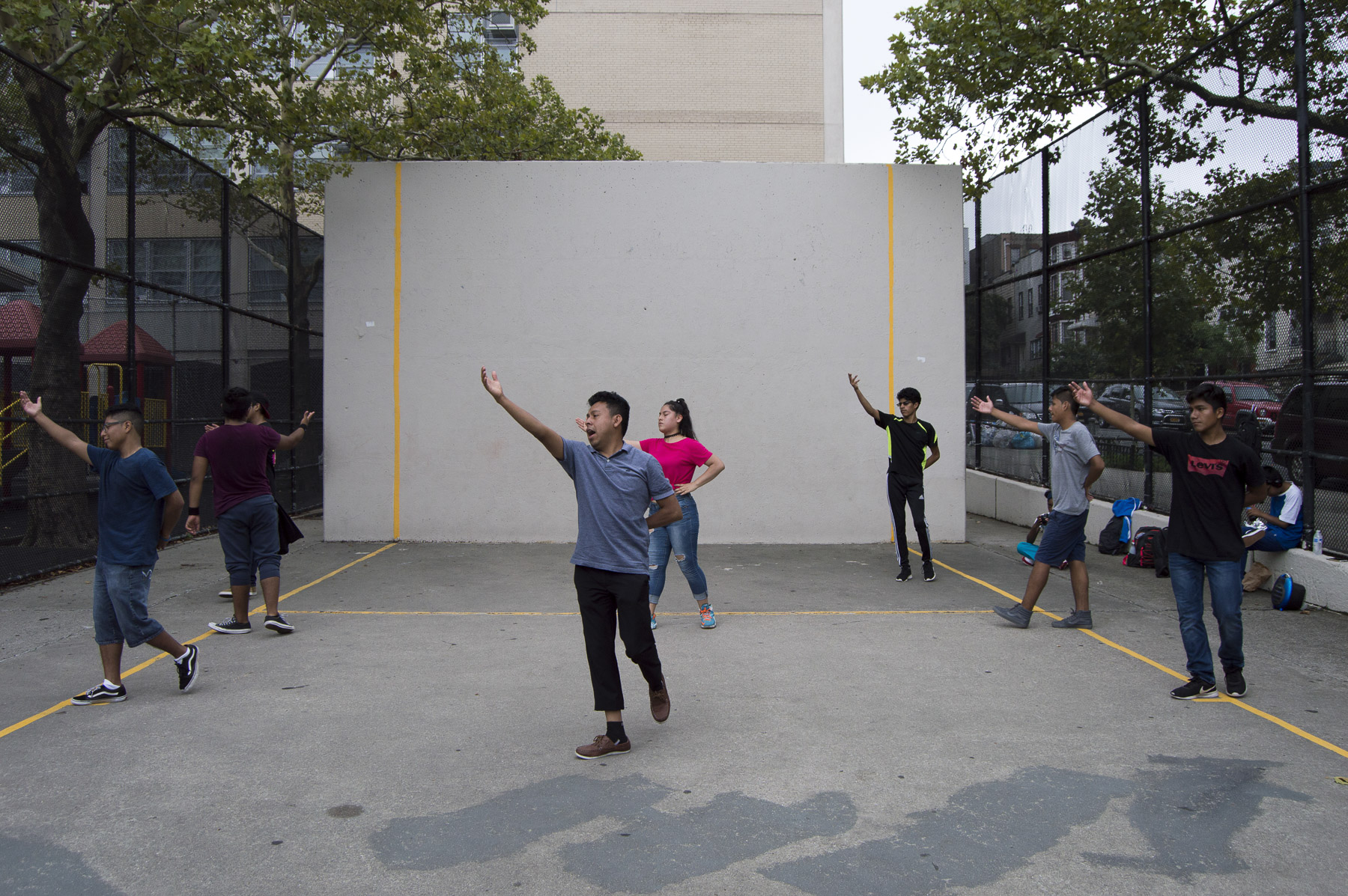 Benito Bravo shows his dance company steps for a Quinceñera. Gabrielle Narcisse and Deleelah Saleh for Picture Justice. August 17th, 2017, Brooklyn, Hena Perrera Park, 47th and 4th ave.
