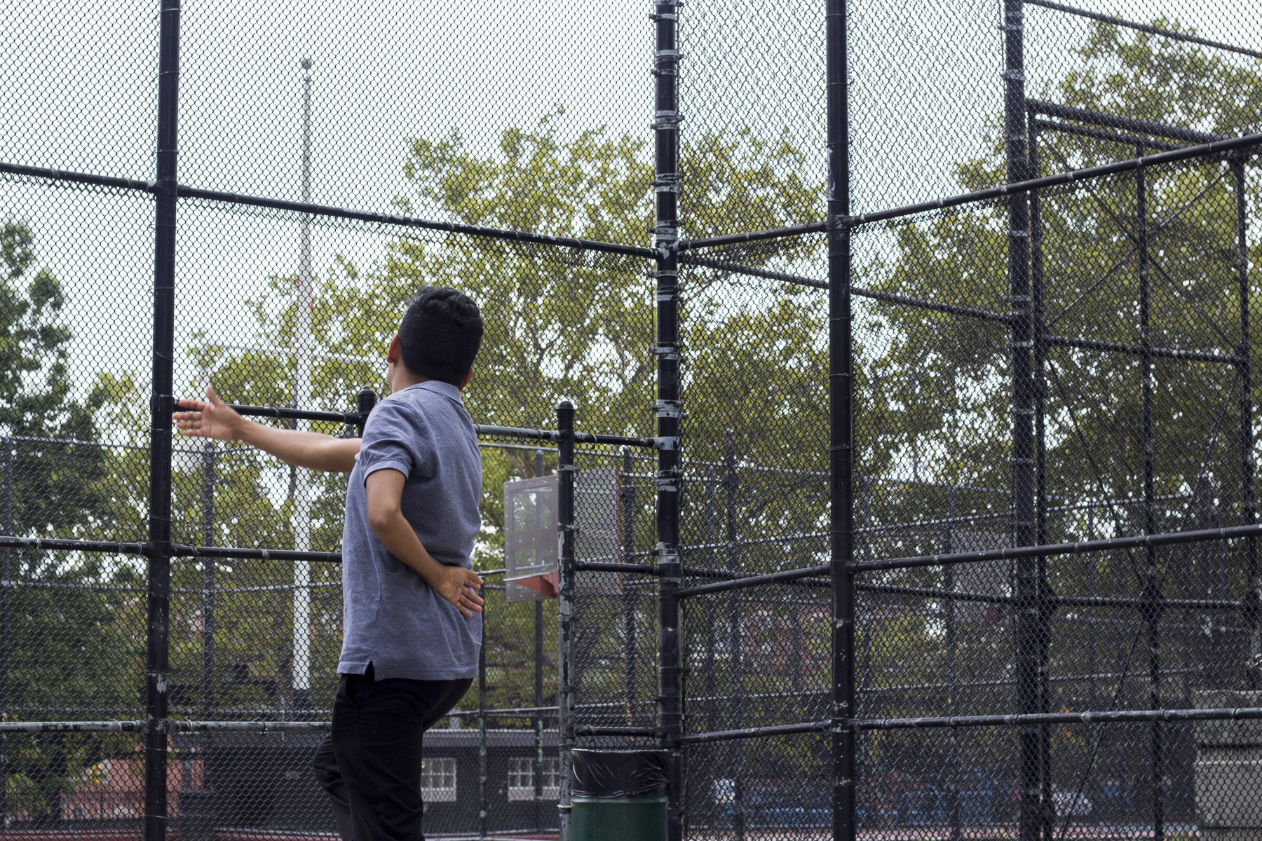 On a very humid summer afternoon, Benito Bravo demonstrates a step for his dance students. Gabrielle Narcisse and Deleelah Saleh for Picture Justice. August 17th, 2017, Brooklyn, Hena Perrera Park, 47th and 4th ave.