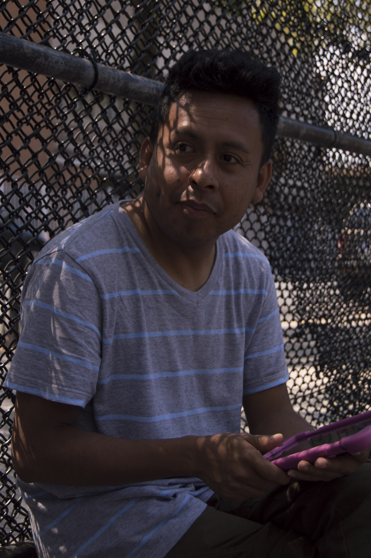  Benito Bravo watches the teens beging their dance routine as he plays the music off of a tablet. Gabrielle Narcisse and Deleelah Saleh for Picture Justice.&nbsp;August 17th, 2017, Brooklyn, Hena Perrera Park, 47th and 4th Ave. 