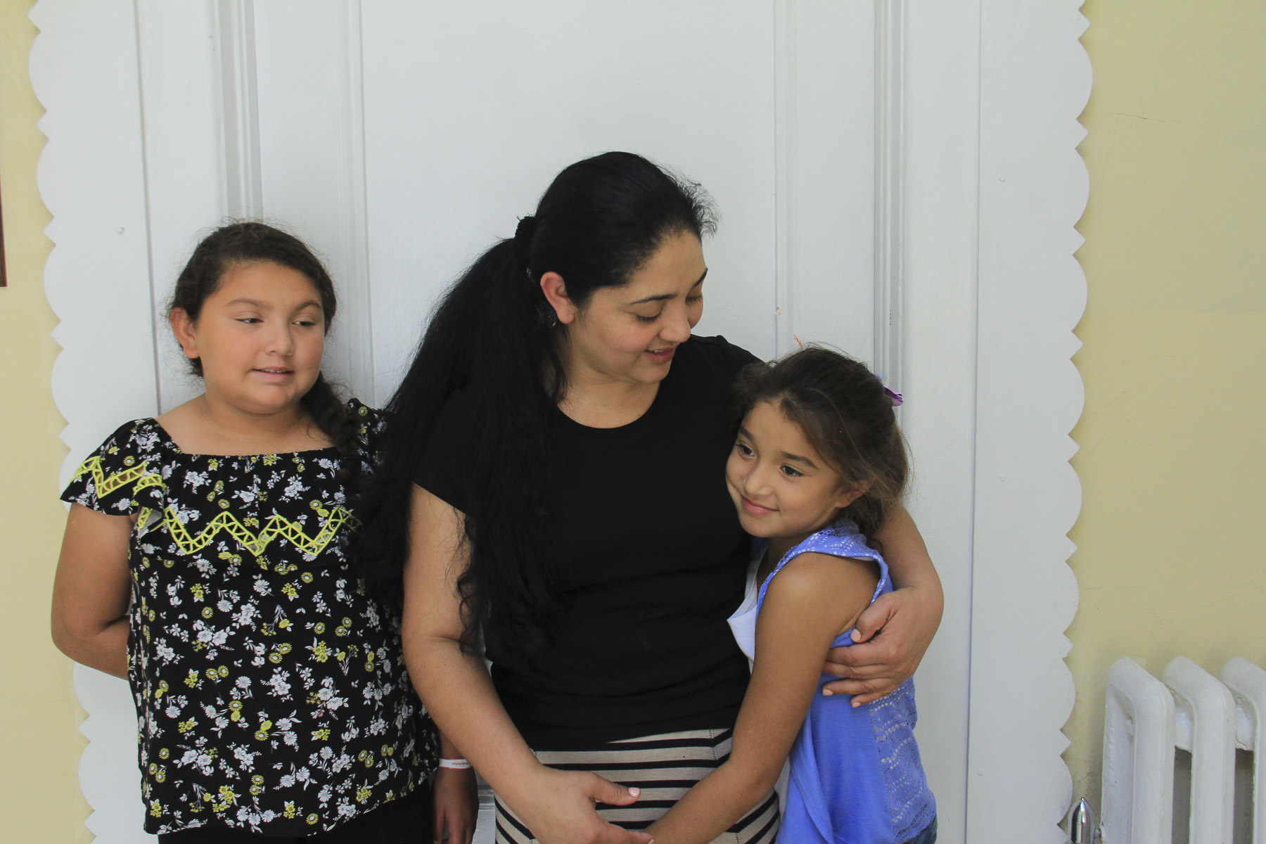  Amanda with two of her children.&nbsp;Holyrood Episcopal Church in Washington Heights, New York. August 17, 2017. 