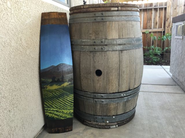 This photo helps depict the size of the wine barrel paintings.