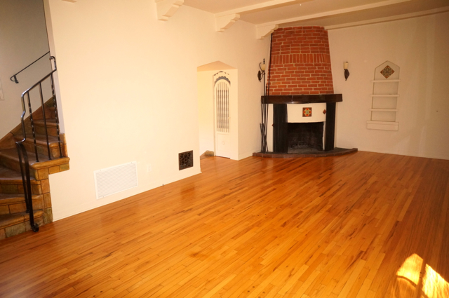 Living Room With Working Wood-Burning Fireplace