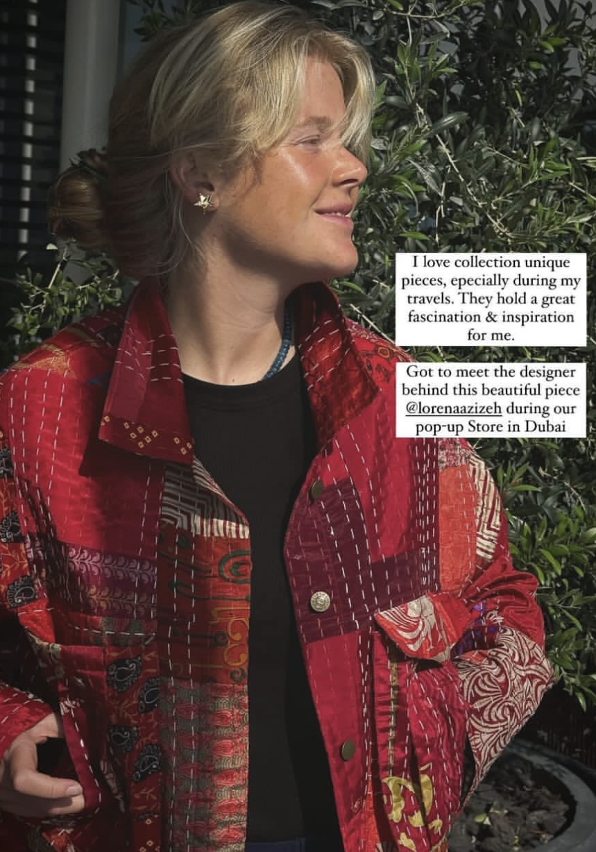 A happy client modelling her one of a kind jacket from Azizeh