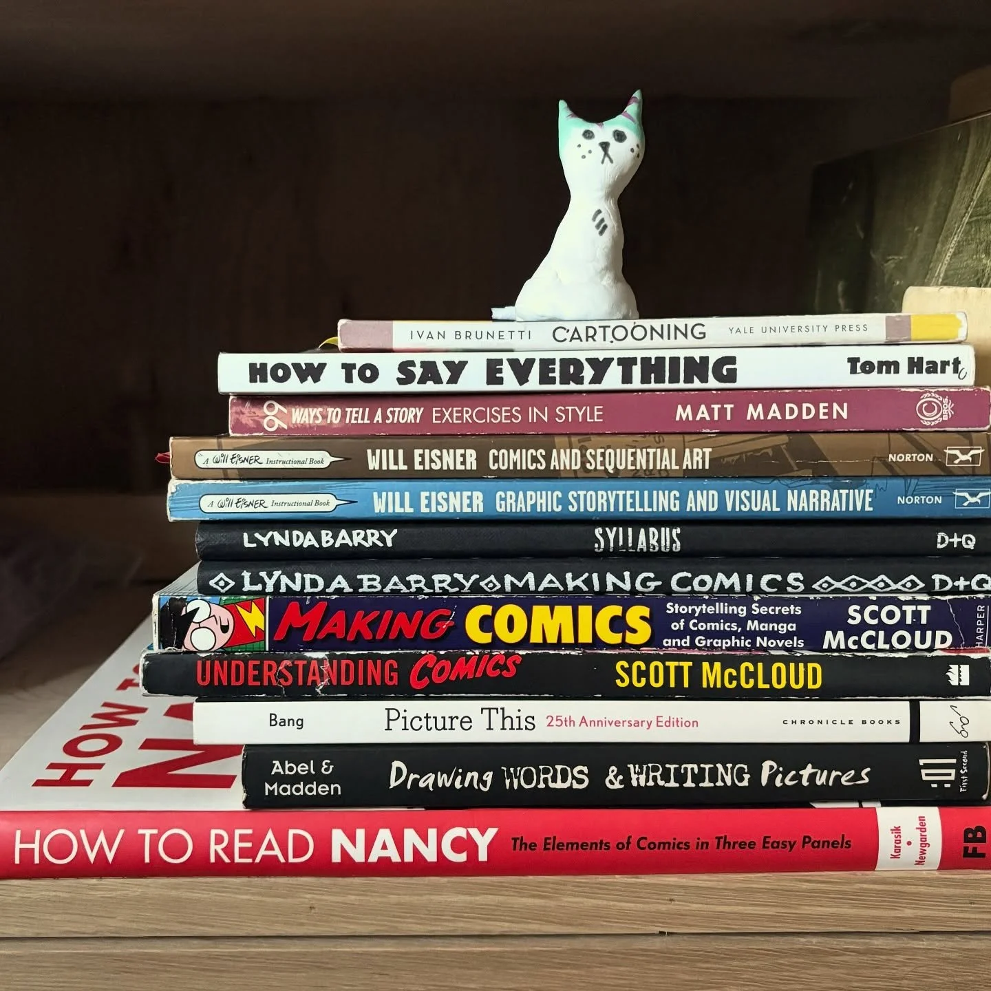 I get to be a Professor of Comics this fall semester and these are my sacred texts. 🍎 

Any thoughts or recommendations are welcome, just raise your hand if you have something to share with the class.