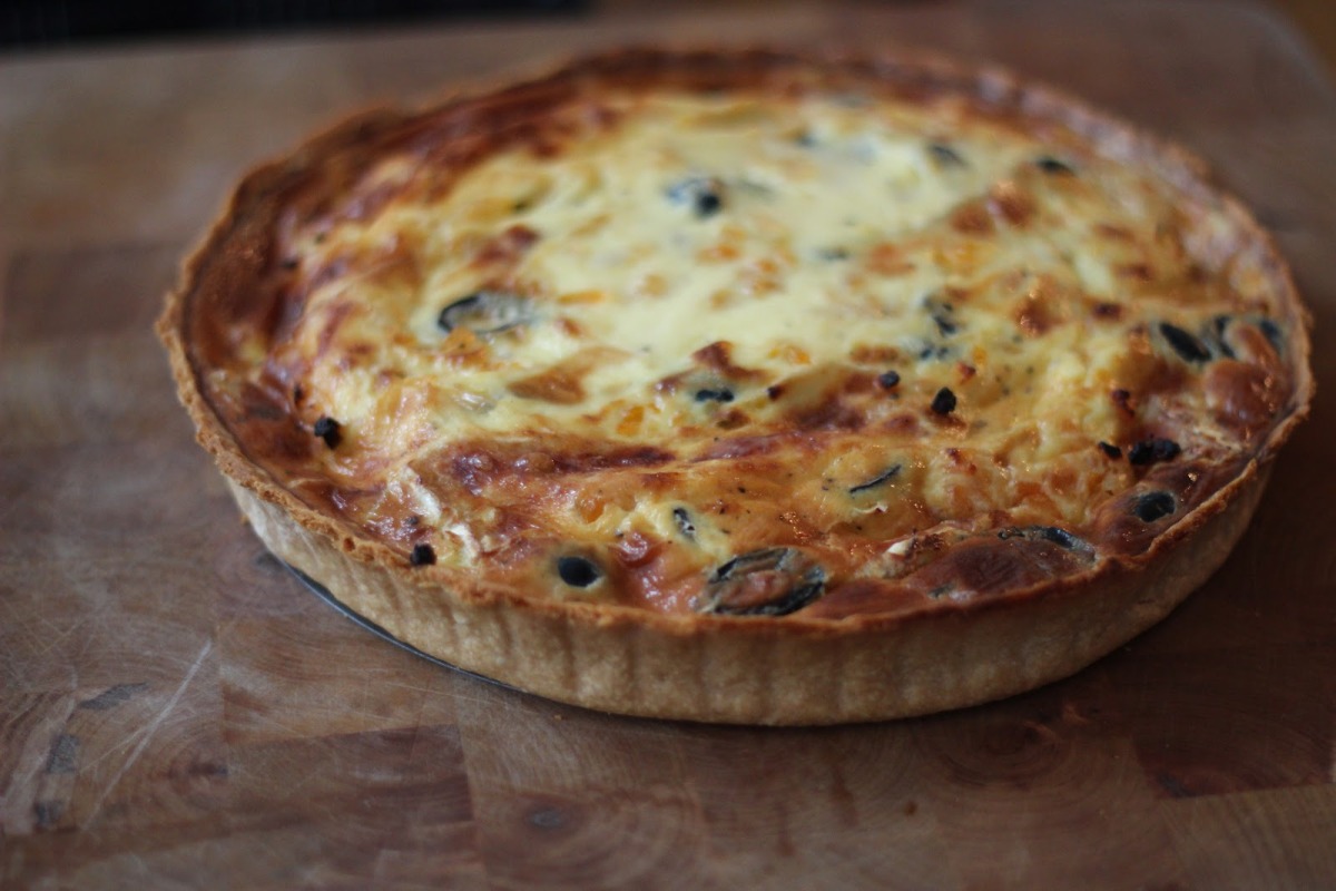 Camembert, black olive and apricot tart