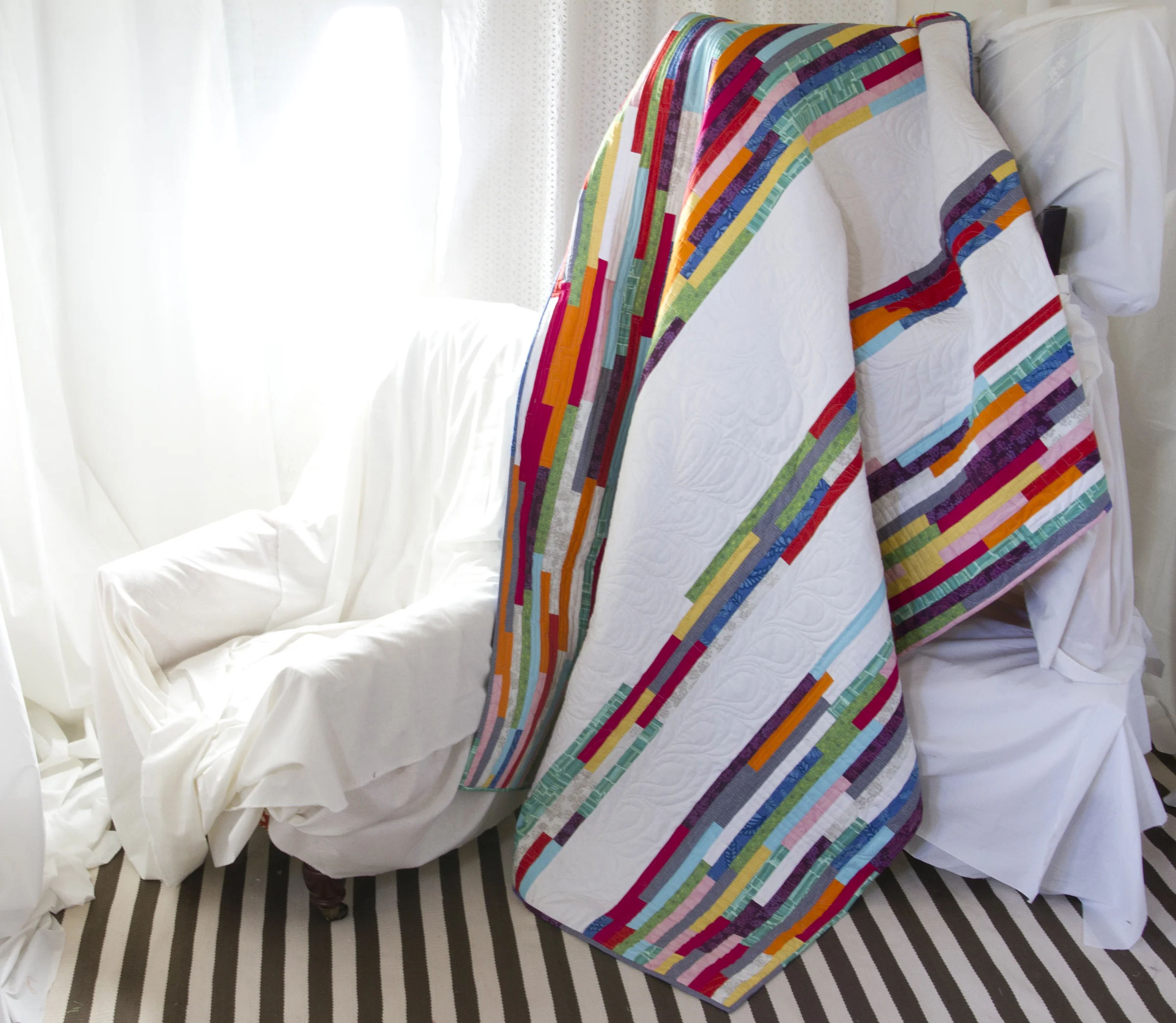 Spring Quilt is made using the Blueprint Basics spring fabrics and Kona Cotton Solids in Pomegranate, Orange, Robin Egg and White. The pattern will be available for free from Robert Kaufman later this spring.