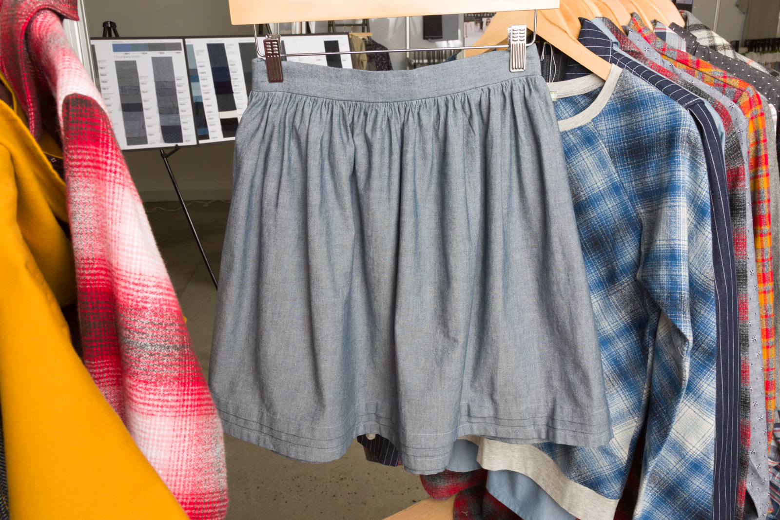 Paris Skirt by Nothing too Fancy , made by Christine Haynes, , featuring Chambray Union Linden Sweatshirt by Grainline Studio , made by Andrea Taddicken , featuring Mammoth Flannel .
