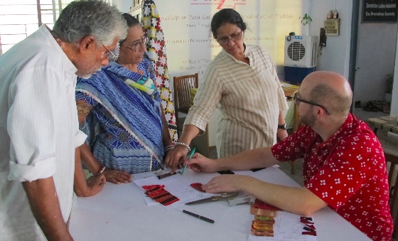 Discussing quilt designs in Ahmedabad