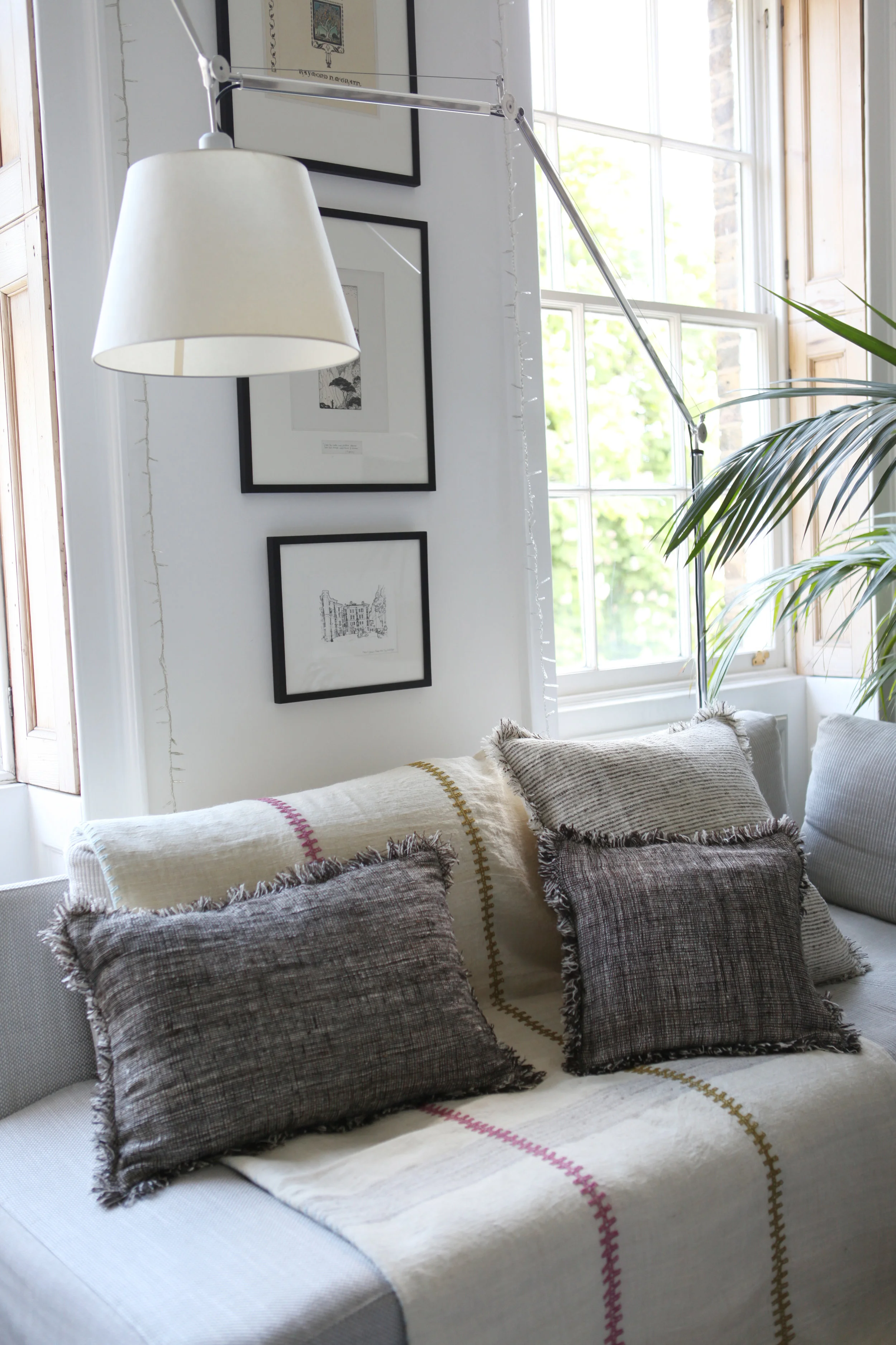 Wool cushions on sofa with throw in modern house