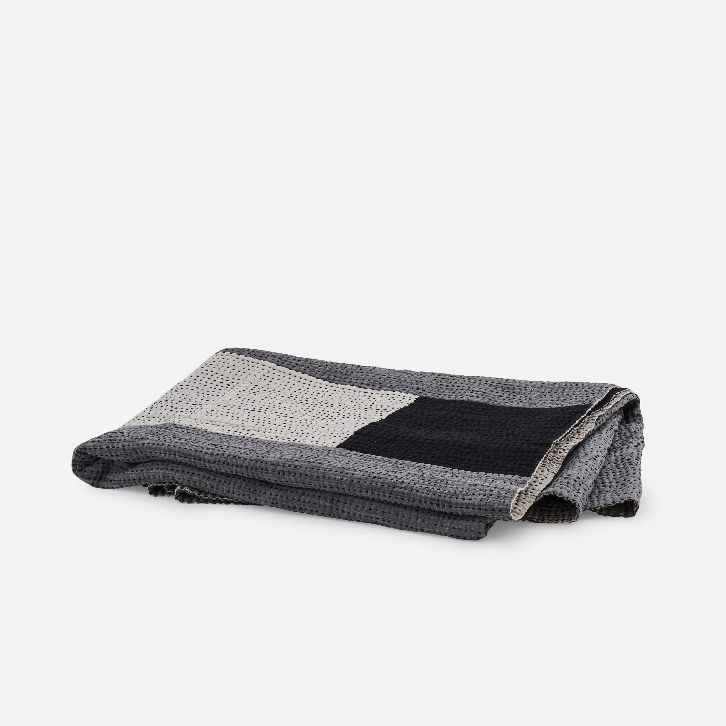 Grey and white and black minimal patchwork quilt
