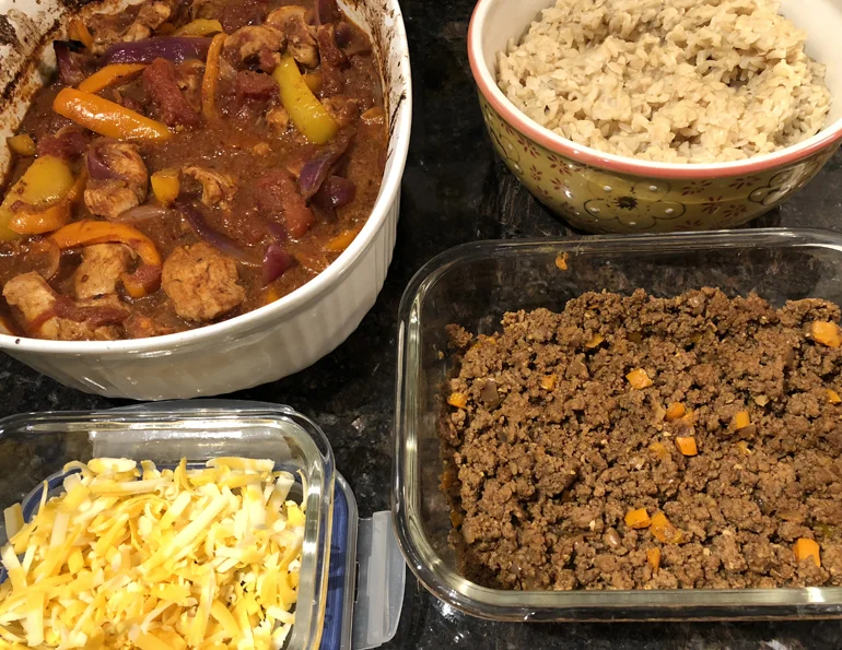 Meal prep allows me to try new recipes AND helps me get my workouts in. From top left, clockwise: baked chicken fajita mix, brown rice, taco beef mix, shredded cheddar.