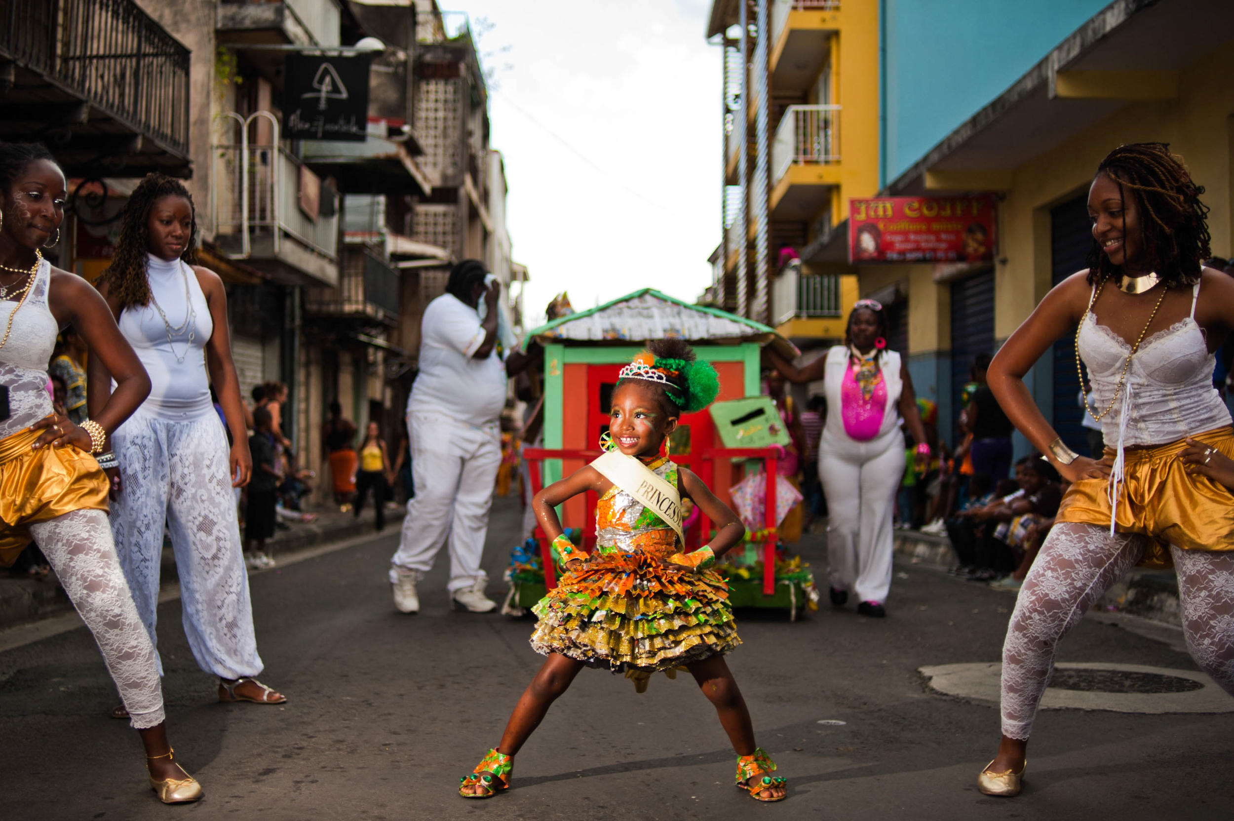 Guadeloupe_winter_carnival,_Pointe-à-Pitre_parade._A_little_girl_performing_a_dance_during_parade_(full_length_outdoor_portrait).jpg