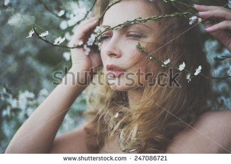 mysterious-beautiful-girl-with-flowers-in-her-hair-queen-blooming-gardens-fields-of-flowers-247086721.jpg