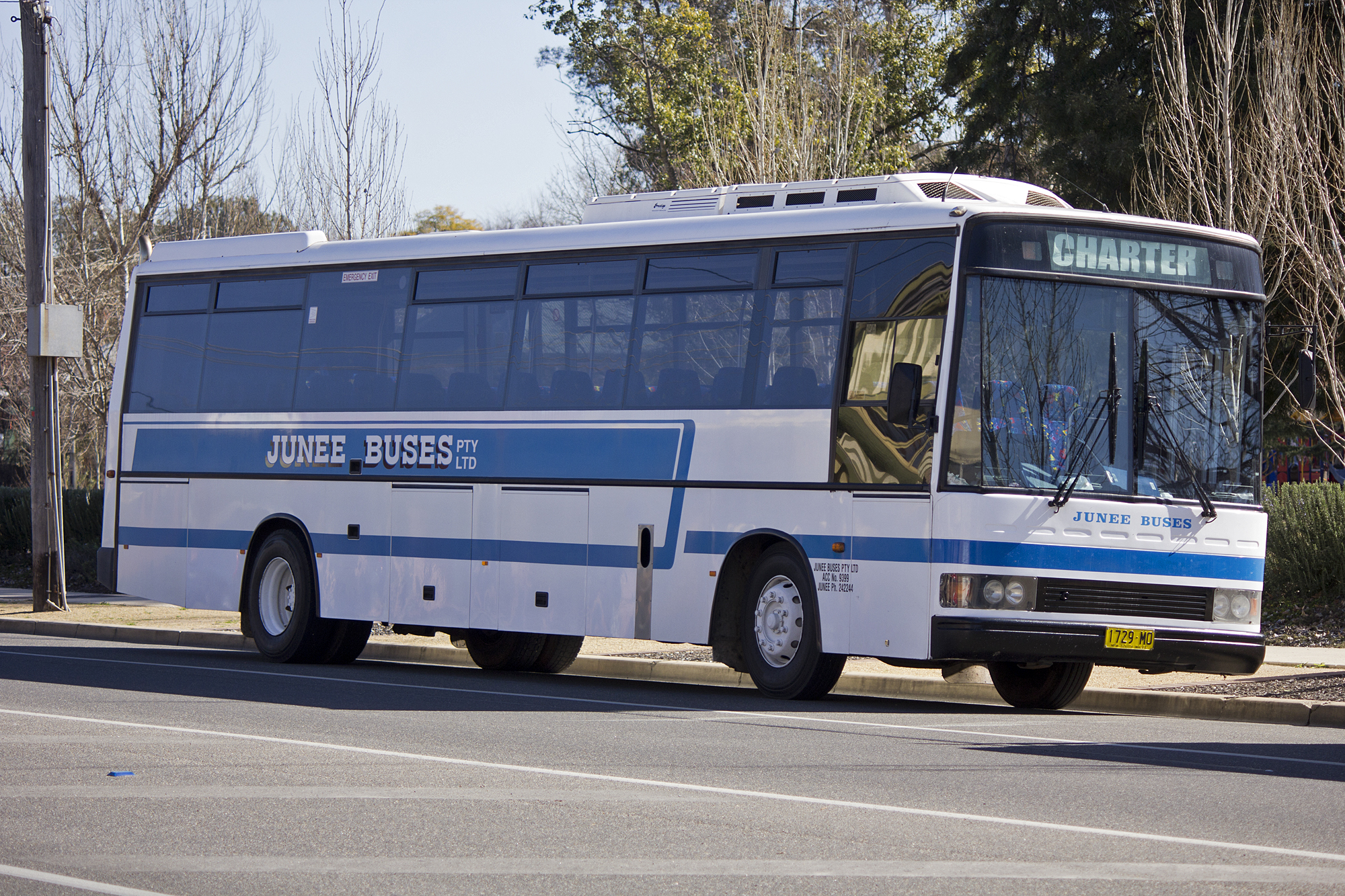 Junee_Buses_PMCA_'XL'_bodied_Hino_RG197K_parked_in_a_bus_stop_on_Morrow_Street_in_Wagga_Wagga.jpg