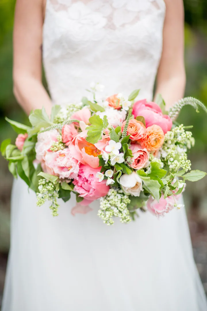 A beautiful bride holding a bouquet by my favorite floral designer, Revel Floral.
