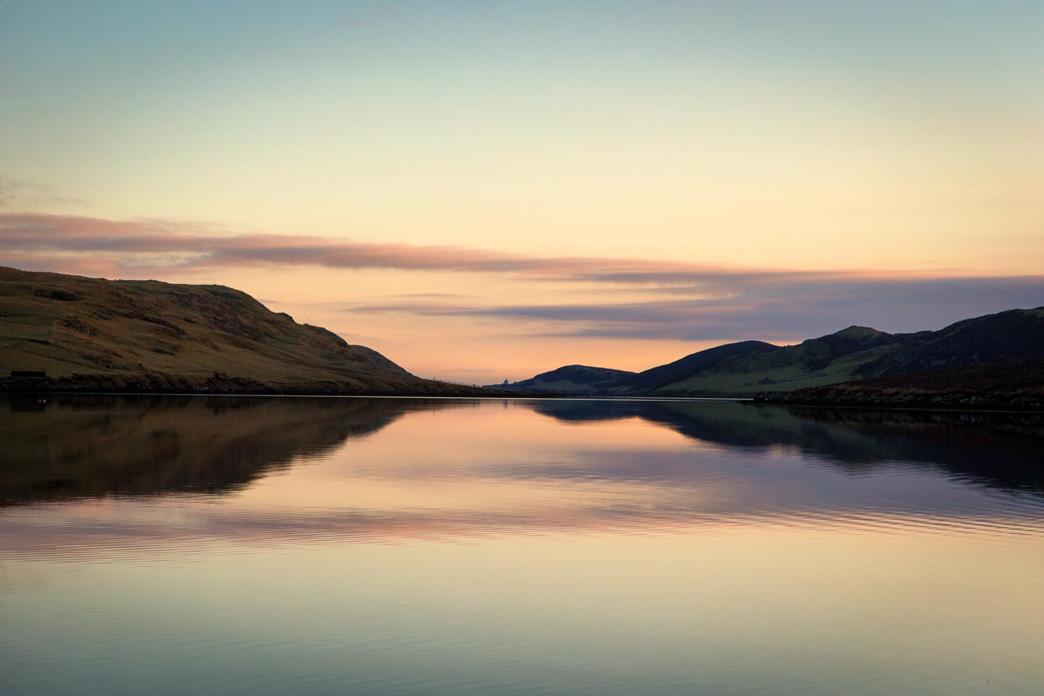 Sunset looking out Strom Ness Voe with Binna Ness in the distance.