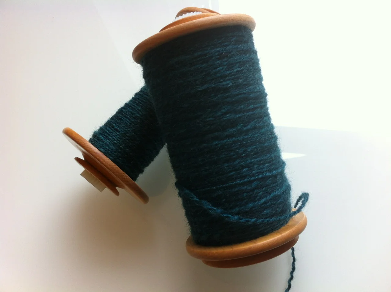 Two 4-oz braids of SweetGeorgia Yarns Blue-Faced Leicester wool fibre spun over three days at Wool House and plied on on the fourth.
