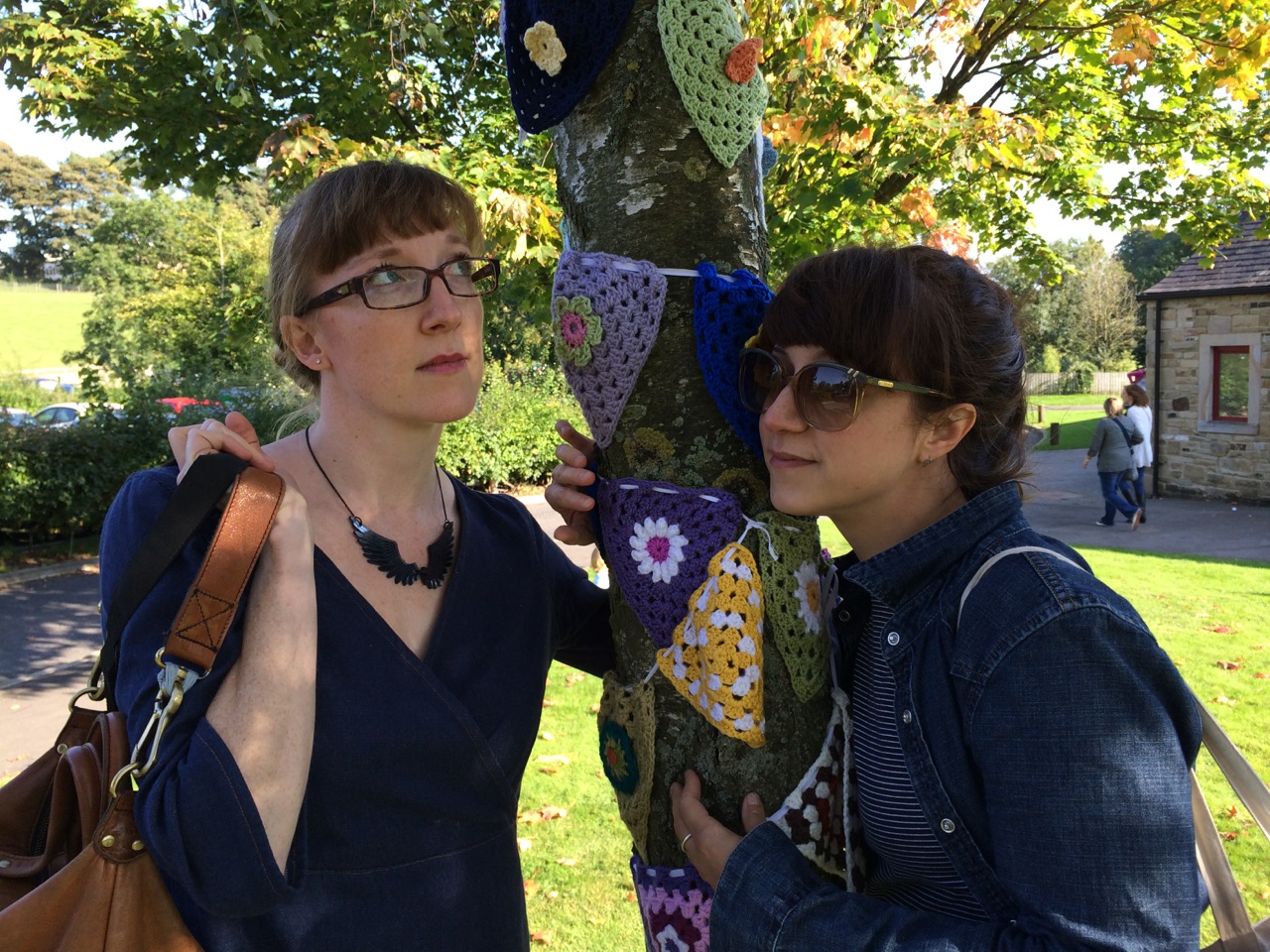 That's Renee on the left and Linda on the right - tree-hugging the yarn bomb bunting!