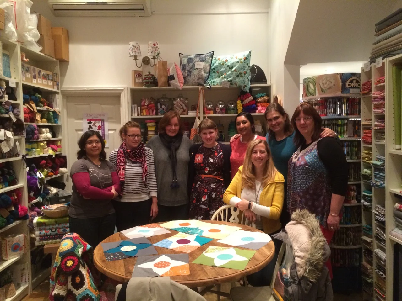 The afternoon session of Lizzy's Meadow Quilt class shows off their first blocks.