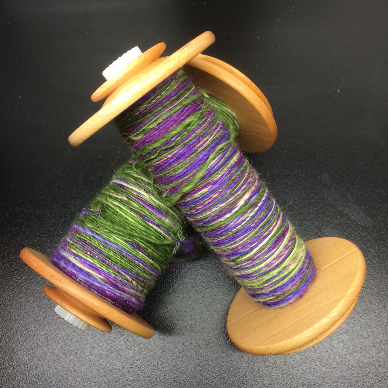 Letting the bobbins rest before finishing. I debated between plying them or leaving them as singles.