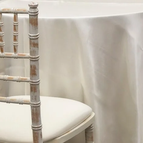 Ivory satin linens 126in round-3.jpg