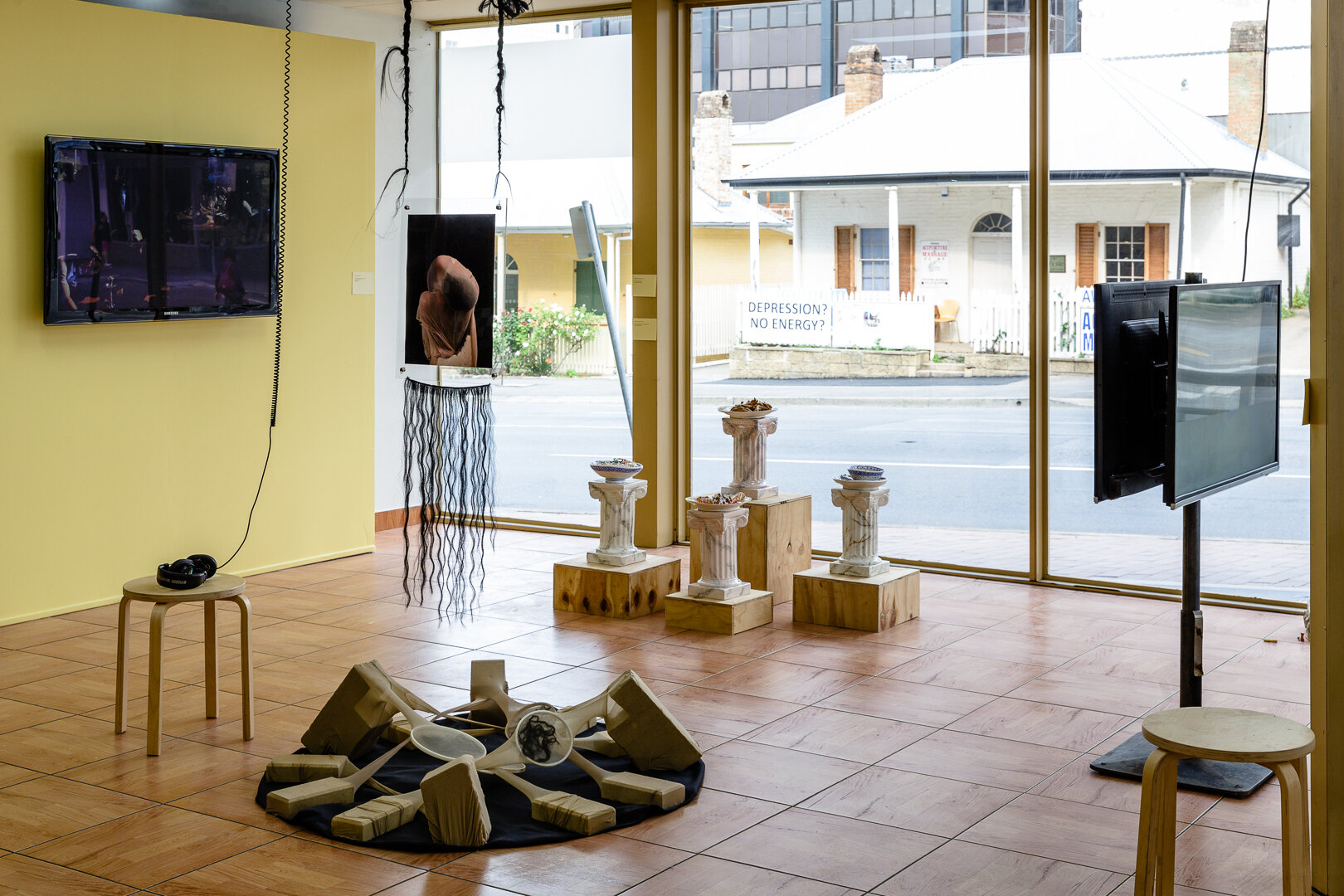   10 Degrees Hotter,  2019, installation view, left: Leila el Rayes,  Live Painting (Revved Up) , 2019, front: Gianna Christella Hayes,  Textural Conversations,  2019, back: Mechelle Bounpraseuth,  Greatest Hits,  2019, right: Shivanjani Lal,  Like t