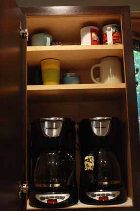 Again - we were really tired of having STUFF take up all our counter space, so we put the coffee makers in the cabinet. Yep - they are plugged in and functional, so you can open the cabinet, grab a mug and choose decaf or regular! Genius...