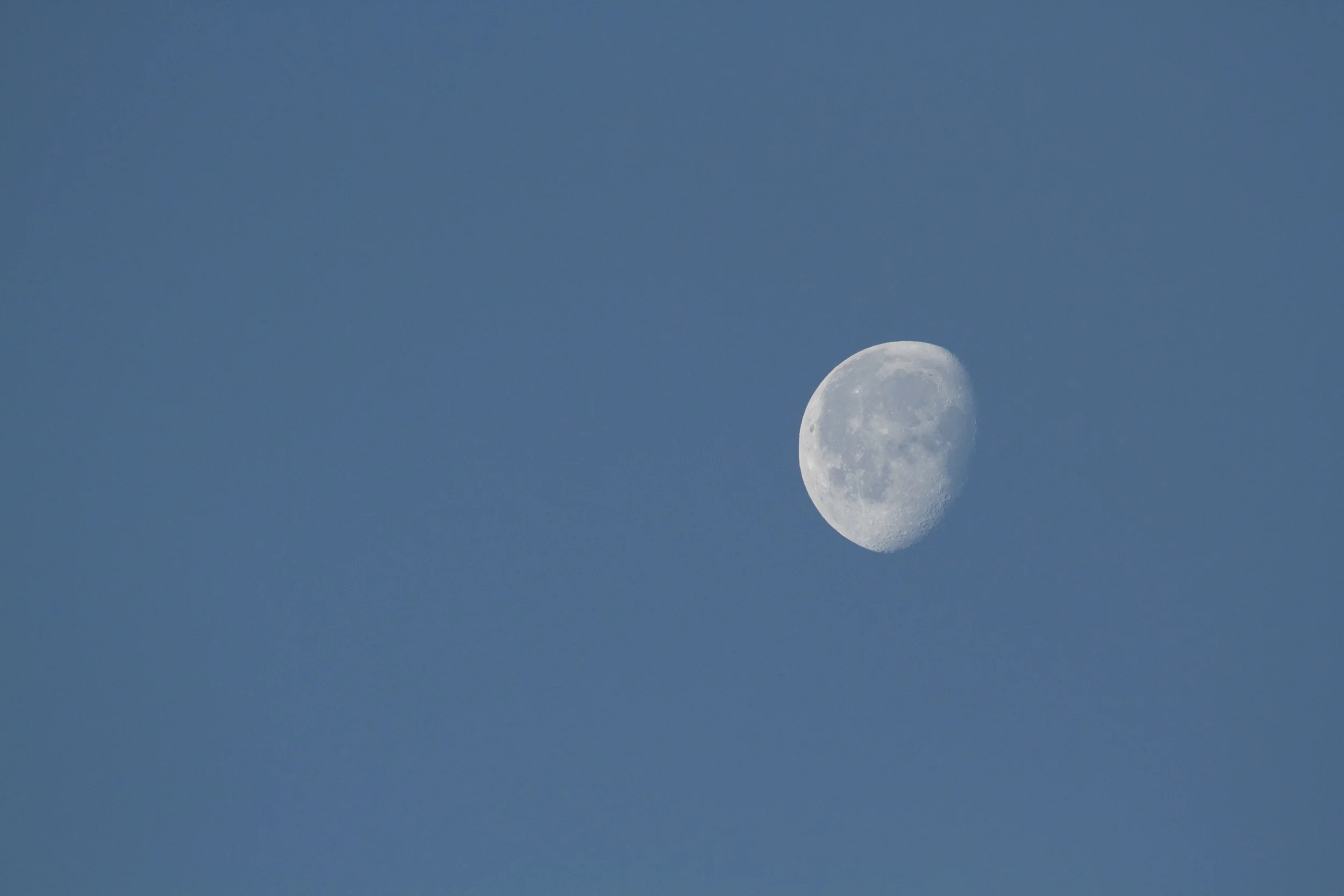 The waning moon in the morning sky.