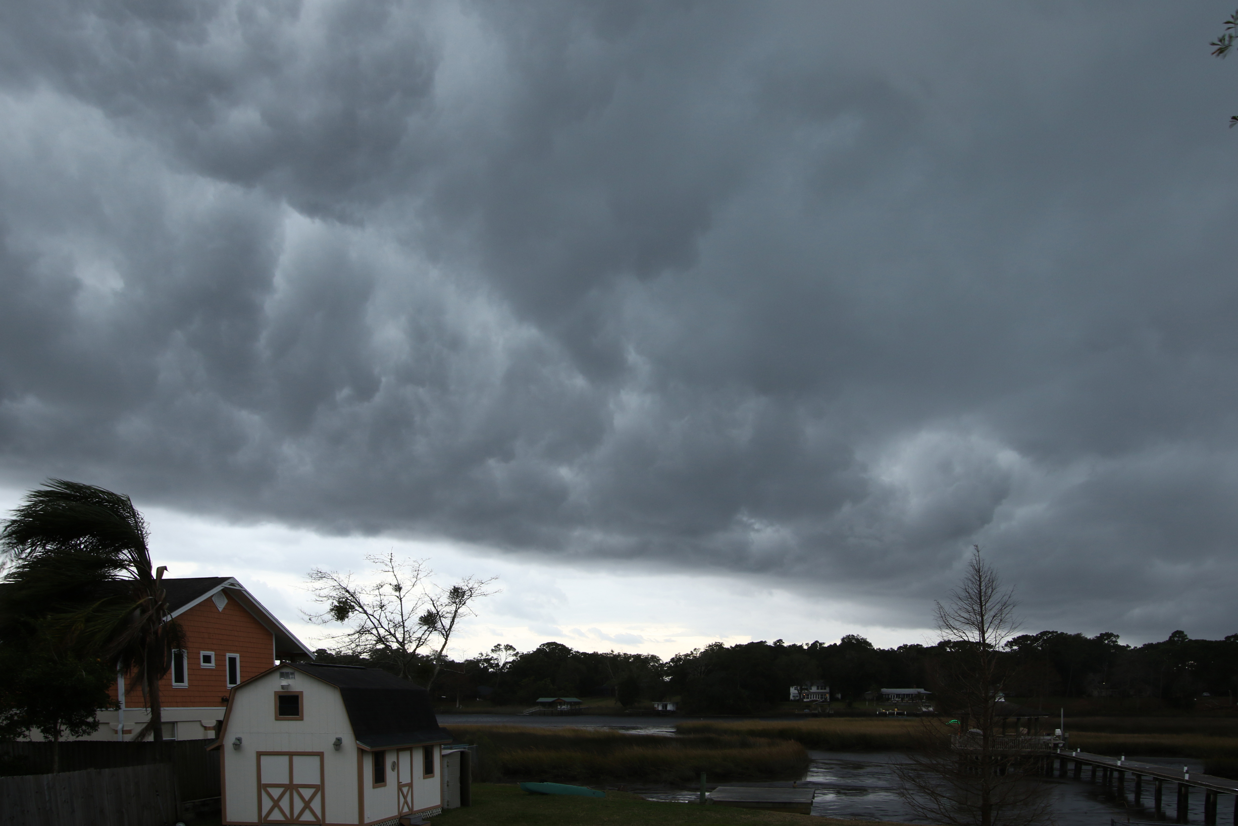 Dark grey clouds roll across the sky over the Broward..