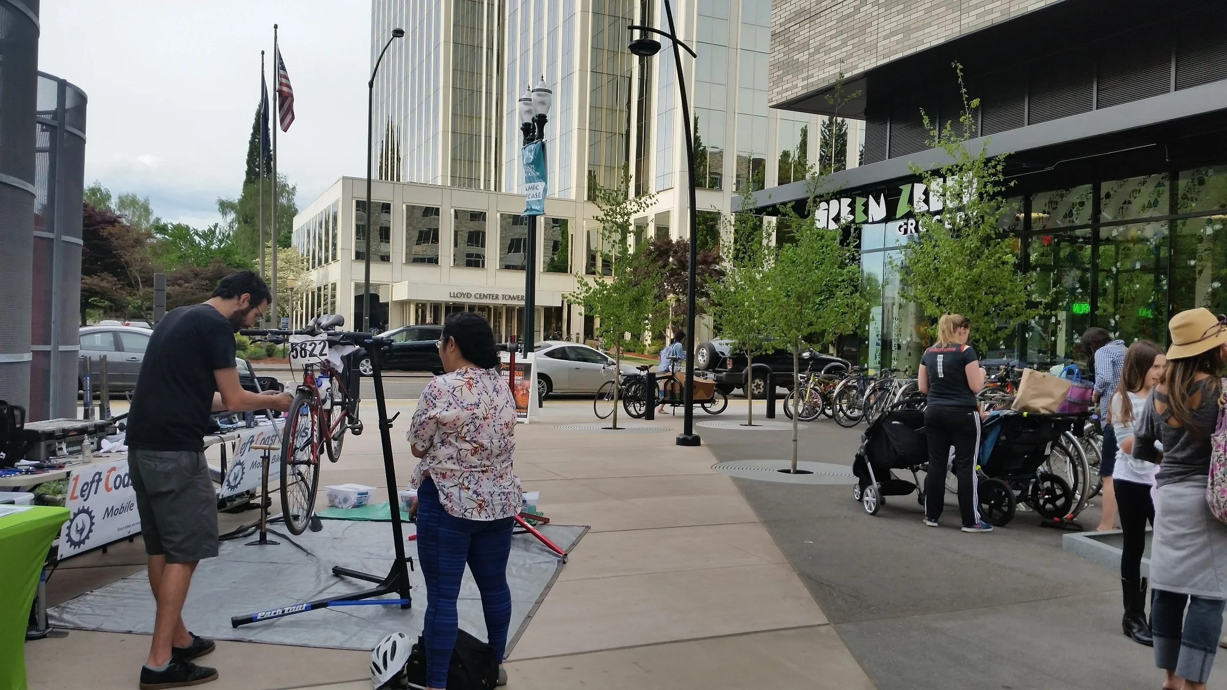 A walk in bike service event in action at the Green Zebra, Lloyd Grand Opening.