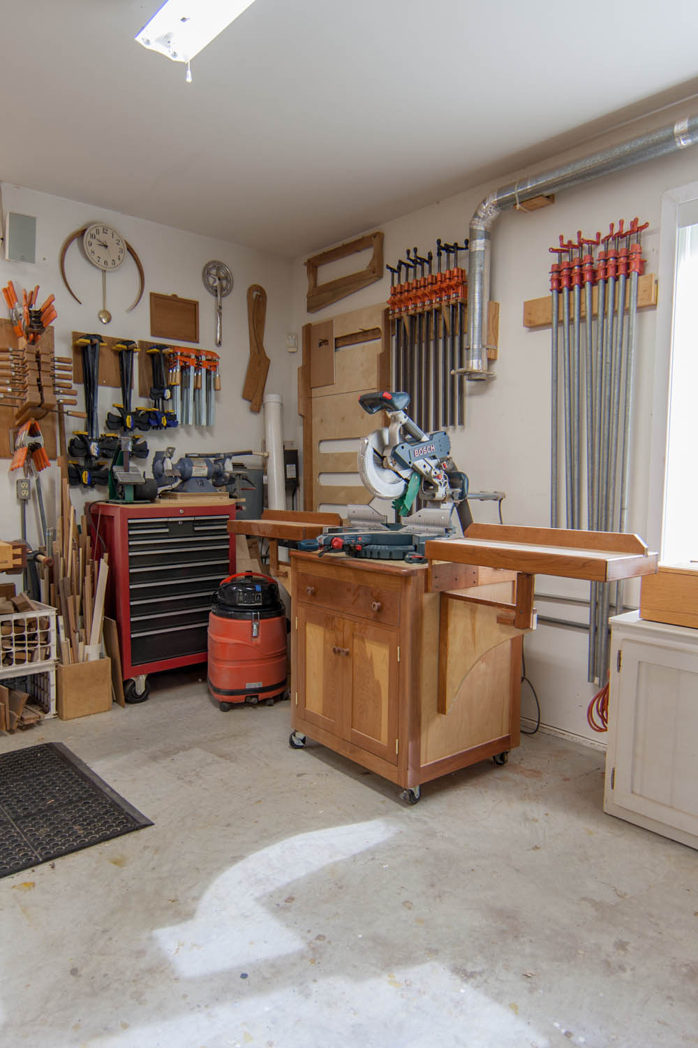 Shop looking NE; Clamp storage, miter saw