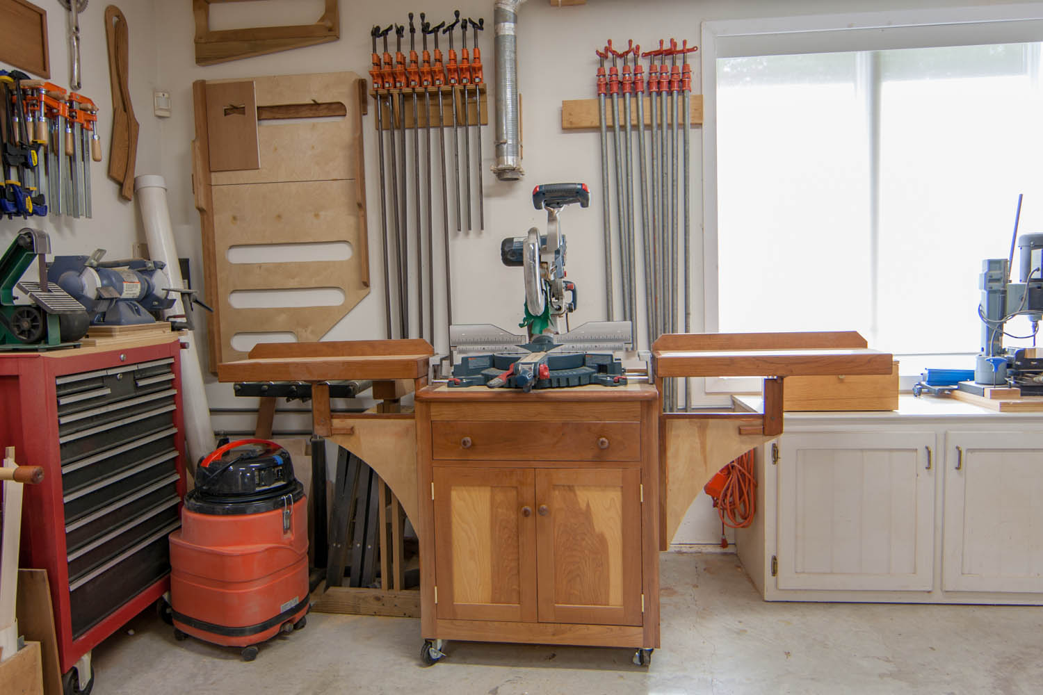 Shop looking East; Shop looking NE; from left, tool box, clamp and jig storage, miter saw, mortising machine