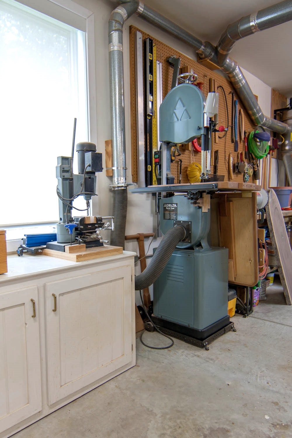 Shop looking SE; from left, mortising machine, band saw, workbench 3