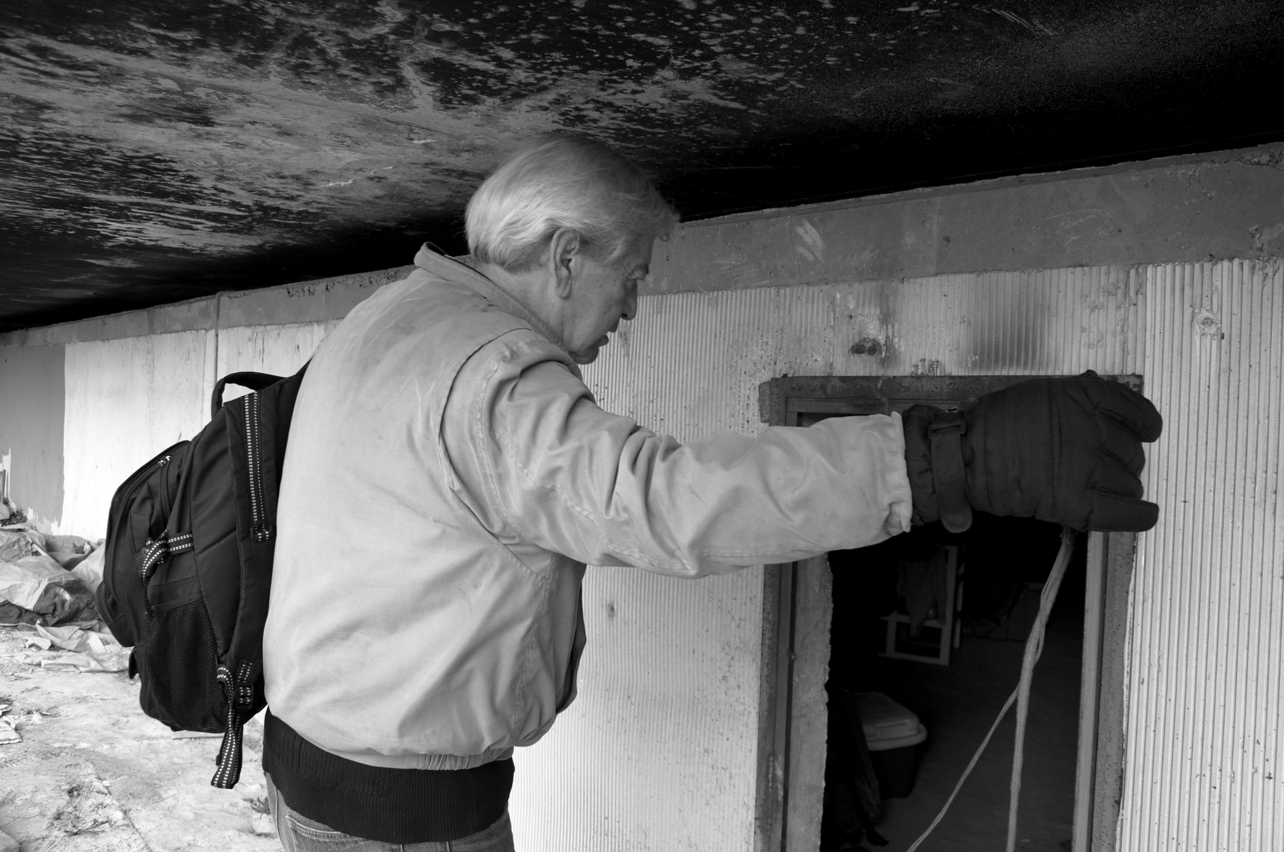  “Is anyone home?” Dr. Anthony Martinez calls as he opens a door underneath an overpass. Mattresses, chairs, clothes, and bottles line the space, but no one responds. 