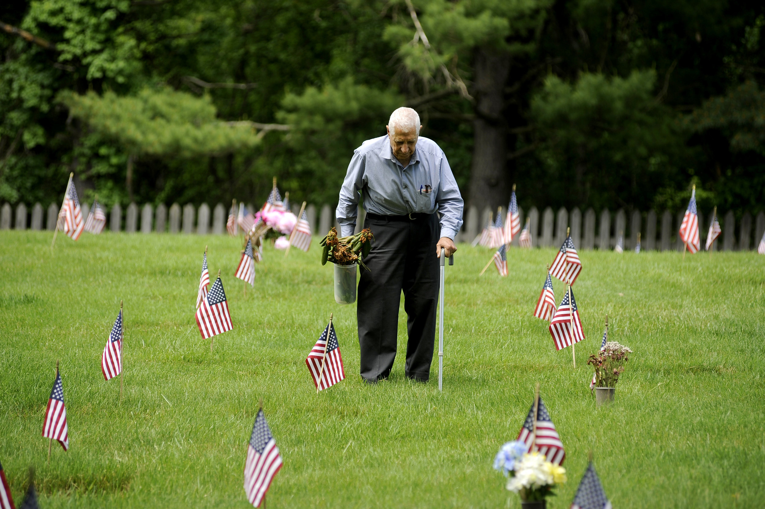   Leo Hindoyan of Towson, Maryland helps to clean up the Dulaney Valley Memorial Gardens in Timonium, Maryland during the Memorial Day ceremonies Monday, May 30, 2016.  