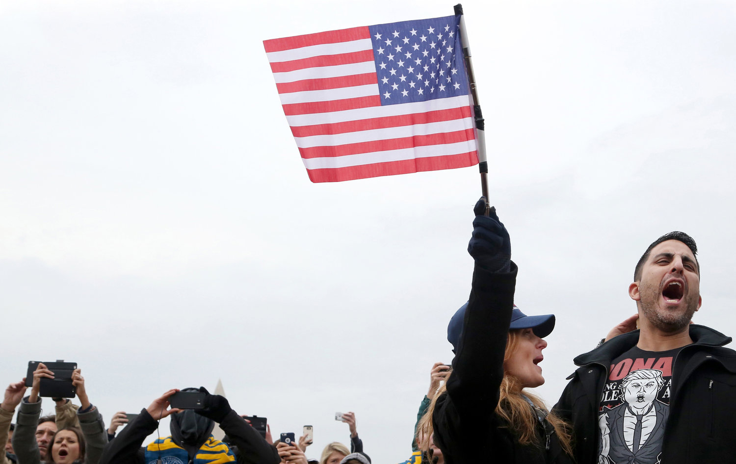 Spectators gather on the National Mall in Washington, D.C., Friday, January 20, 2017, to watch the inauguration of Donald Trump as the 45th President of the United States.