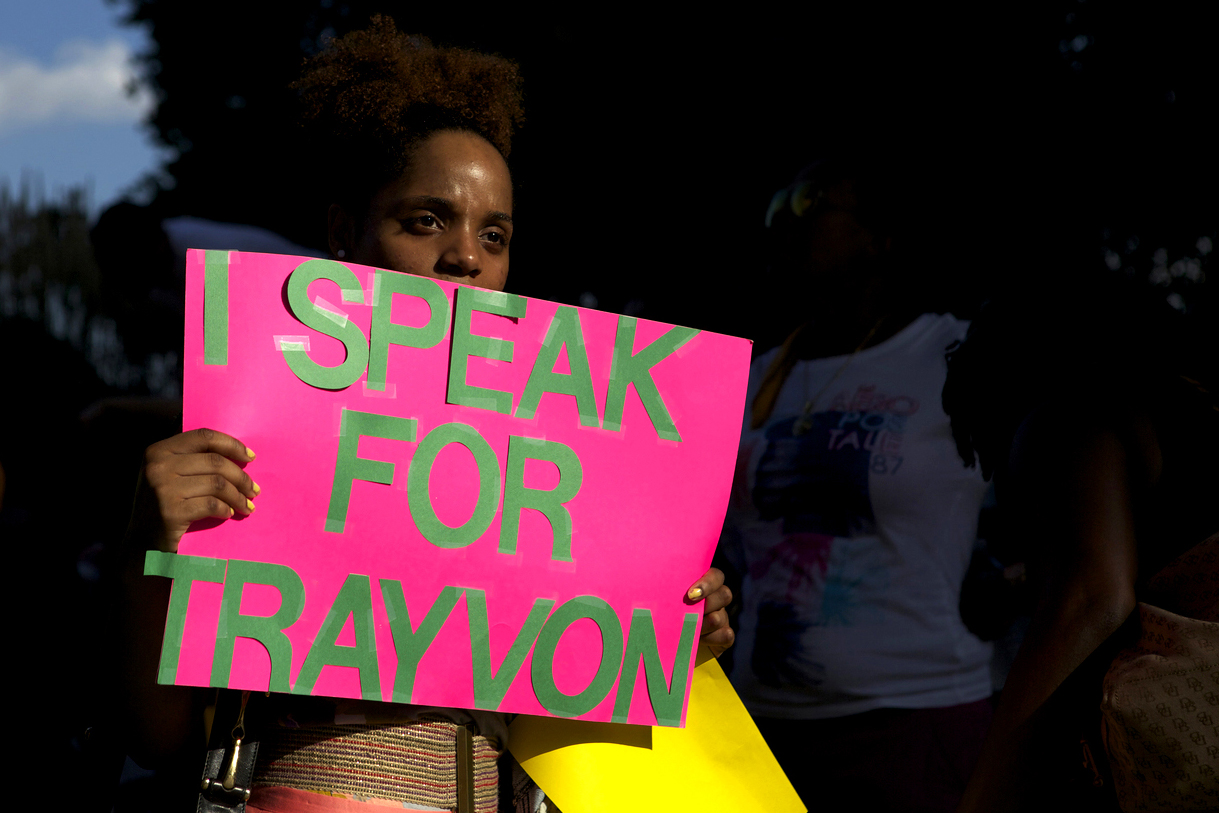  Demonstrators gather at McKeldin Square in Baltimore, Maryland on Monday, July 15, 2013, to protest the acquittal of George Zimmerman, a neighborhood watch volunteer who killed teenager Trayvon Martin on February 26, 2012. 
