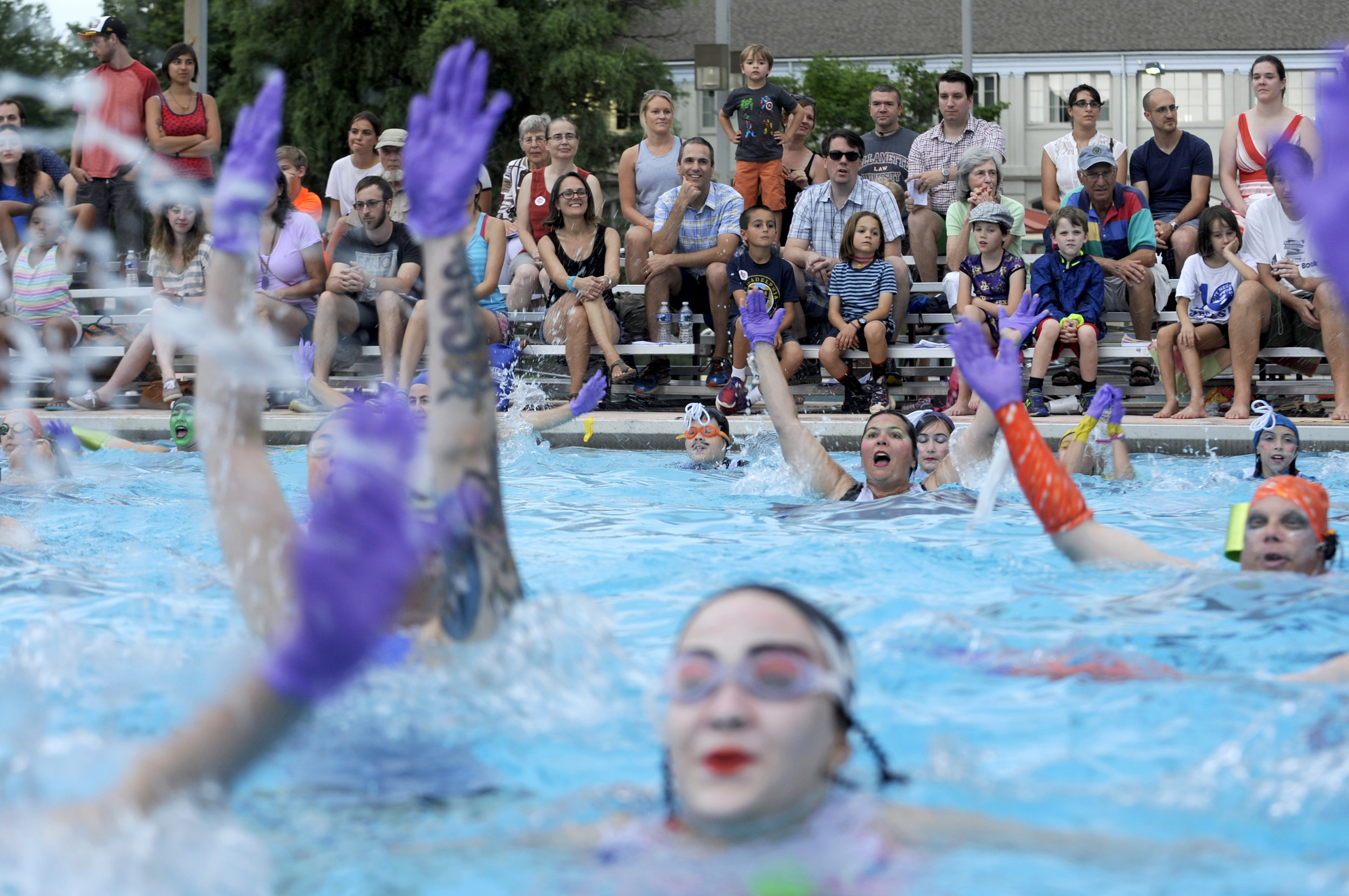  Fluid Movement, a Baltimore-based performance art group known for offbeat water ballets, roller skating musicals and disco workouts, performs its 15th annual synchronized swimming ballet at Druid Park Pool in Baltimore, Maryland on Saturday, July 30
