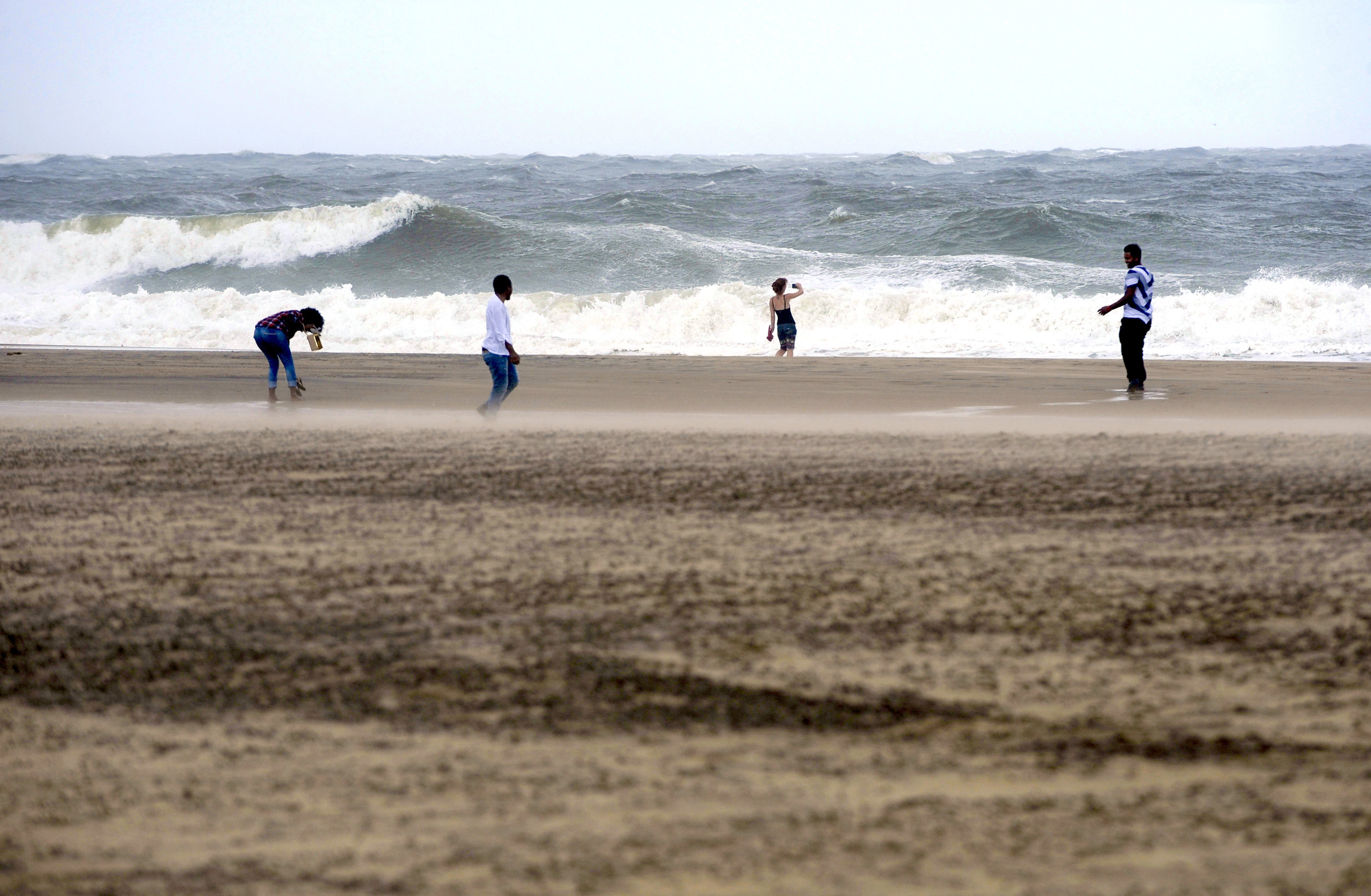 Vacationers take a trip to Ocean City, Maryland on Saturday, September 3, 2016, as Hermine downgraded to a post-tropical cyclone and brushed the resort town over Labor Day weekend.
