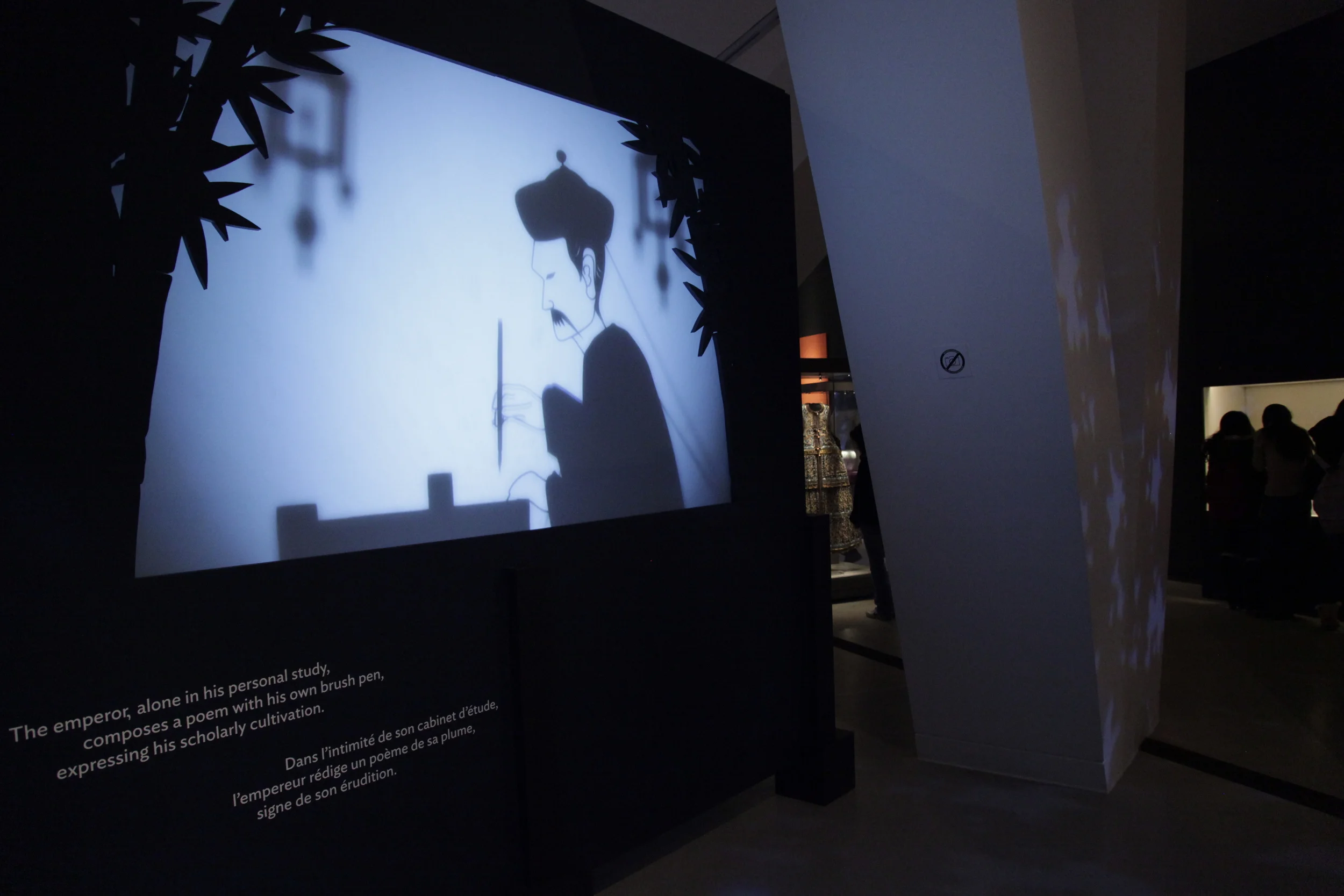   Emperor as Poet    The emperor, alone in his personal study, composes a poem with a brush pen, expressing his scholarly cultivation.&nbsp;  