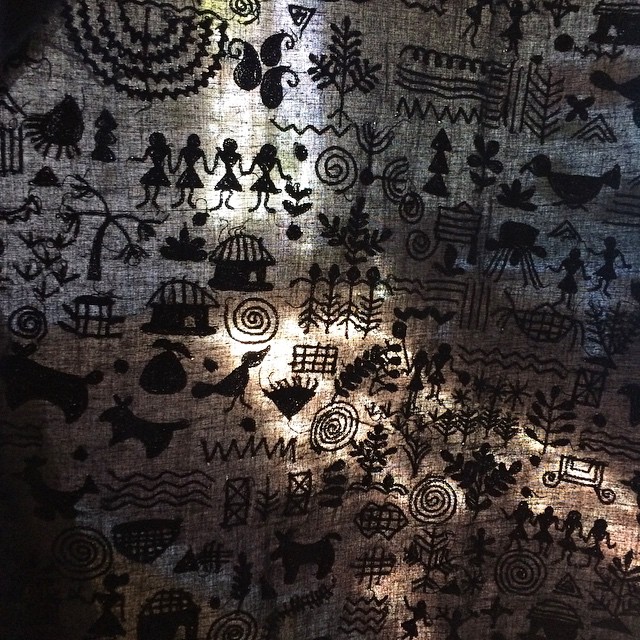 detail_of_new_storytelling_khadi_hand-embroidered_by_Warli_women_depicting_traditional_scenes_from_their_daily_life.jpg