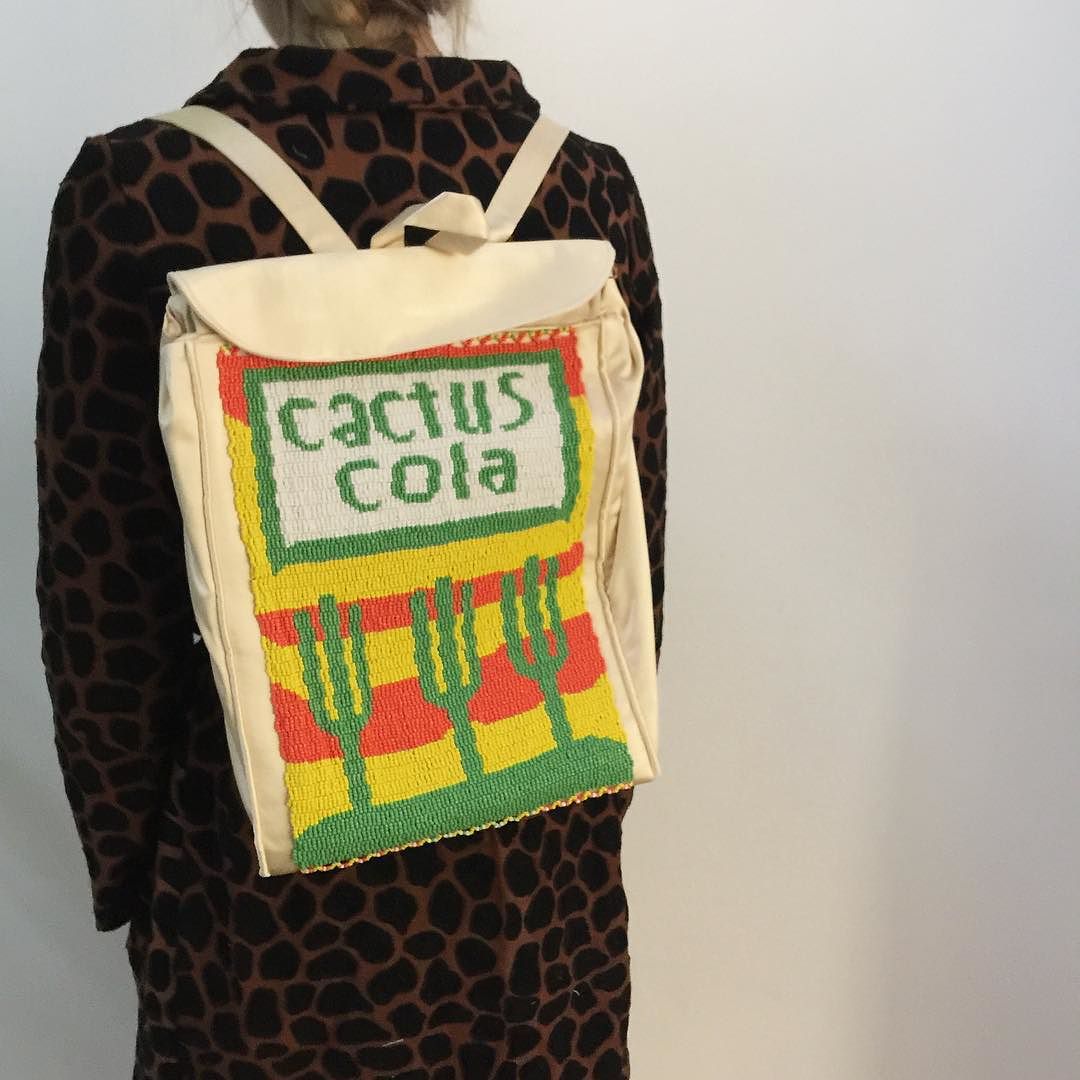 Xhosa beaded soda backpacks & hand-embroidered giraffe overcoat