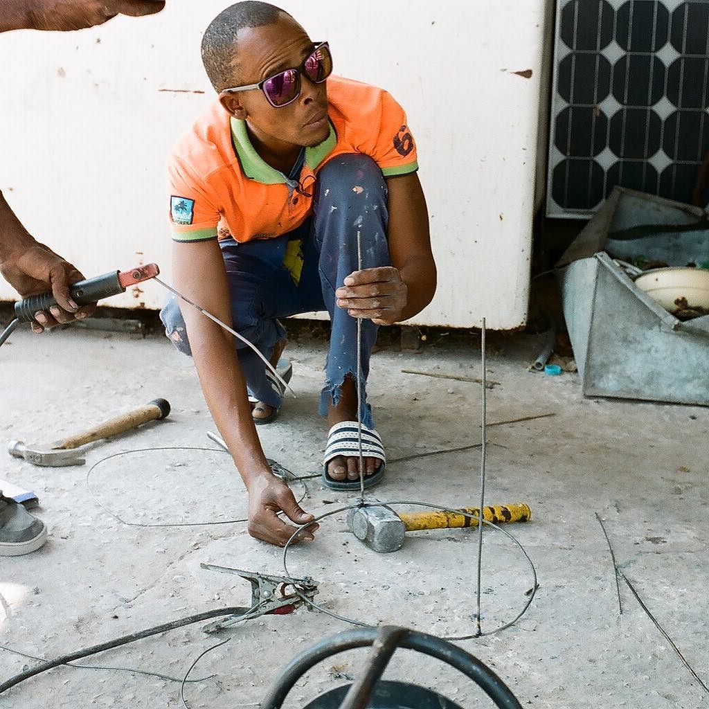 welding lampshades made from metal fences in Tsumkwe